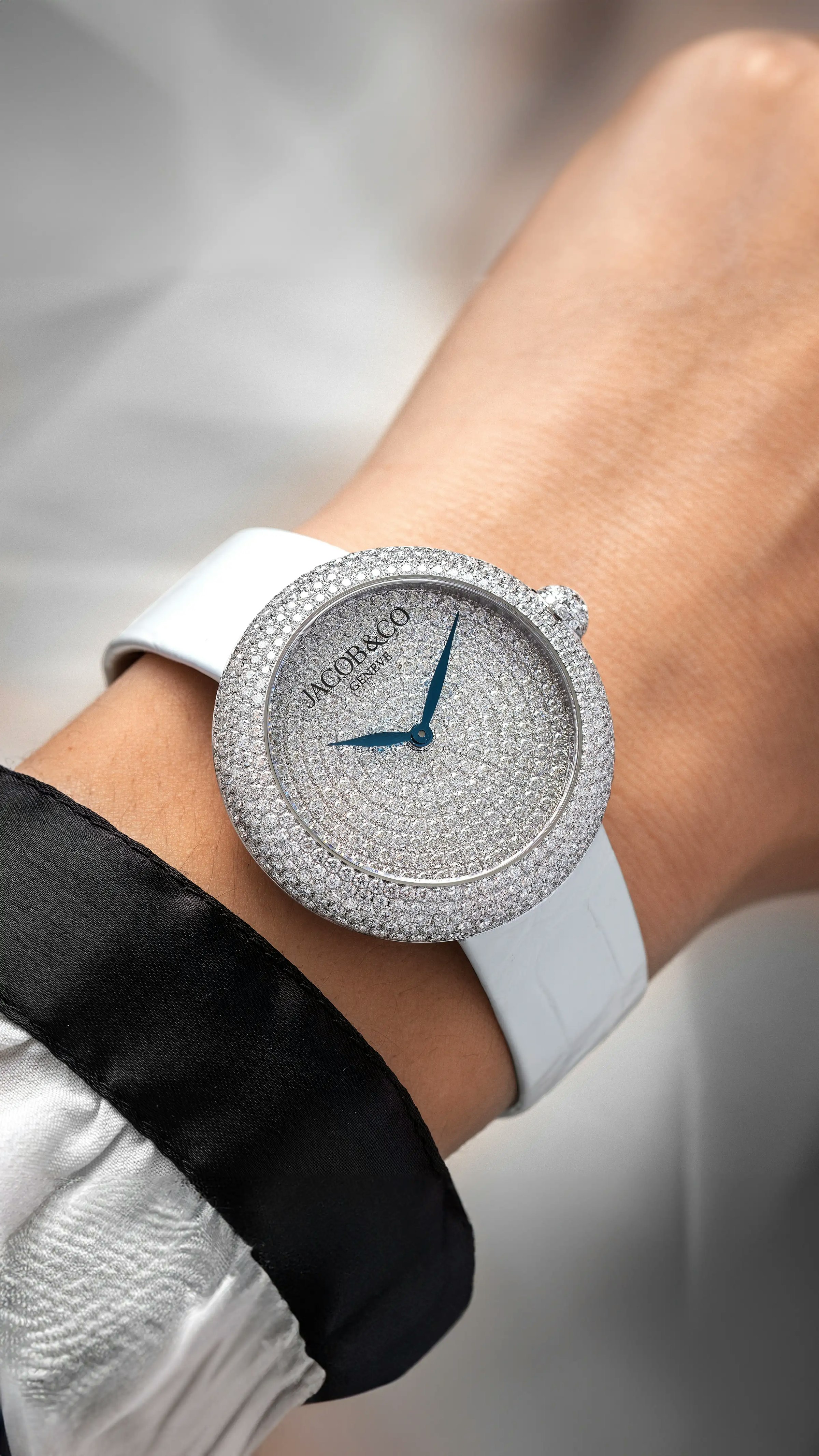 The white gold Brilliant Pavé watch, worn on the left wrist.