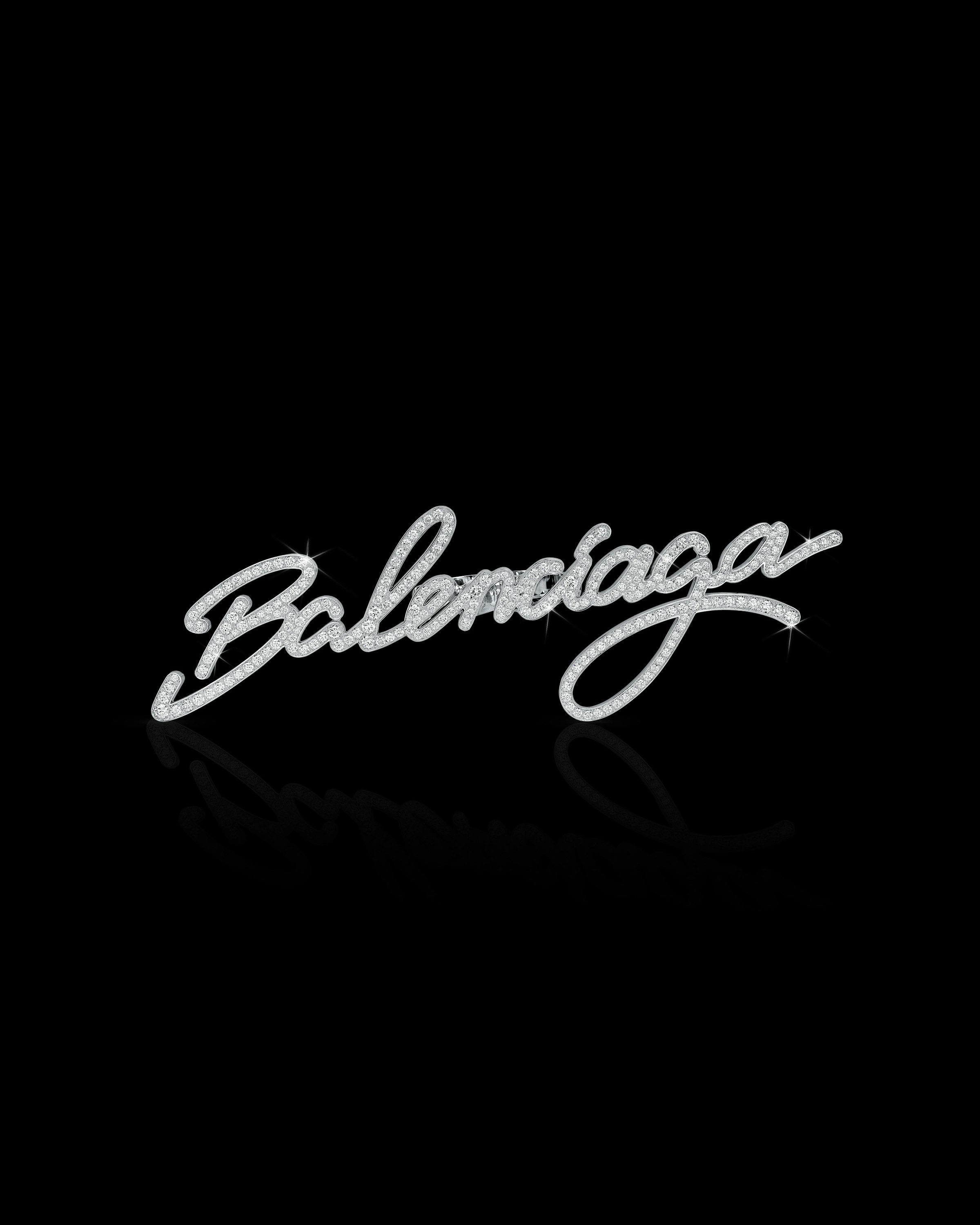 Image of a diamond-studded Balenciaga word written in cursive
