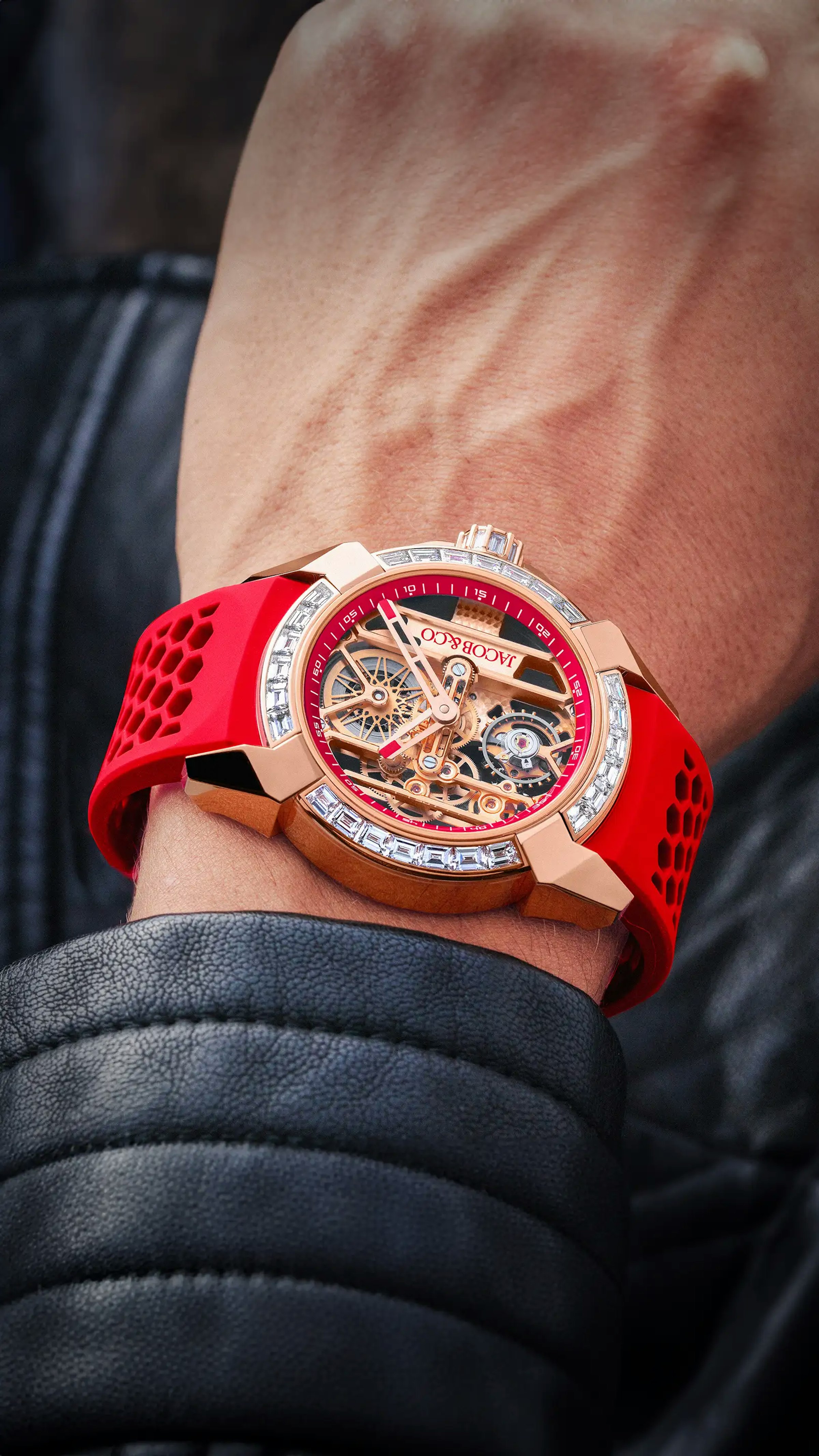 the rose gold epic x baguette, in red, worn on the wrist
