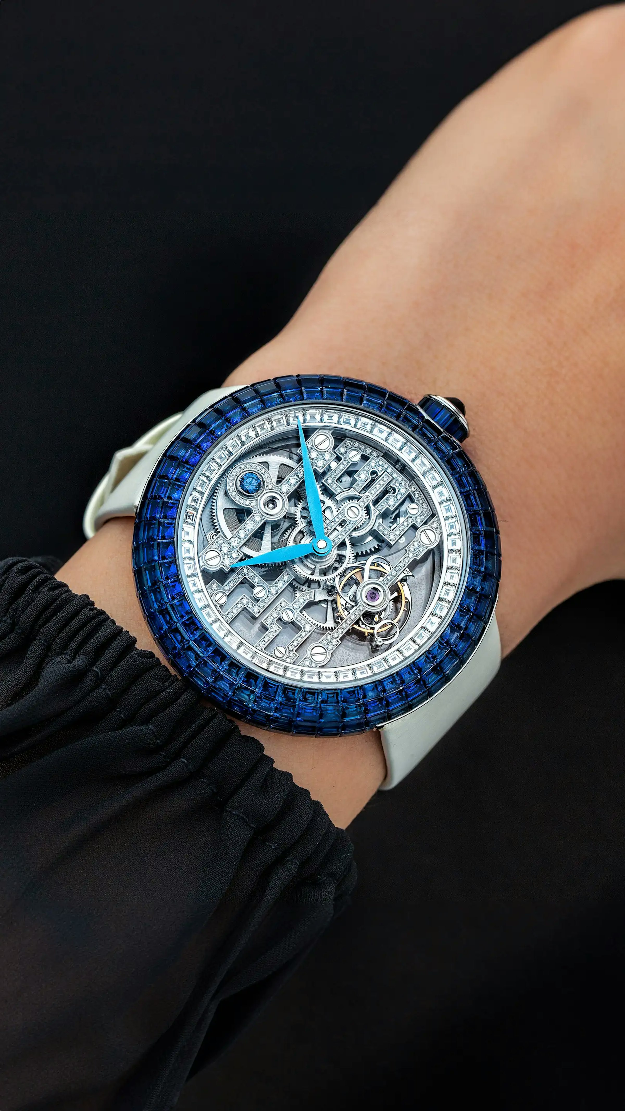 The Blue Sapphire Brilliant Art Deco Tourbillon in white gold, worn on the left wrist.