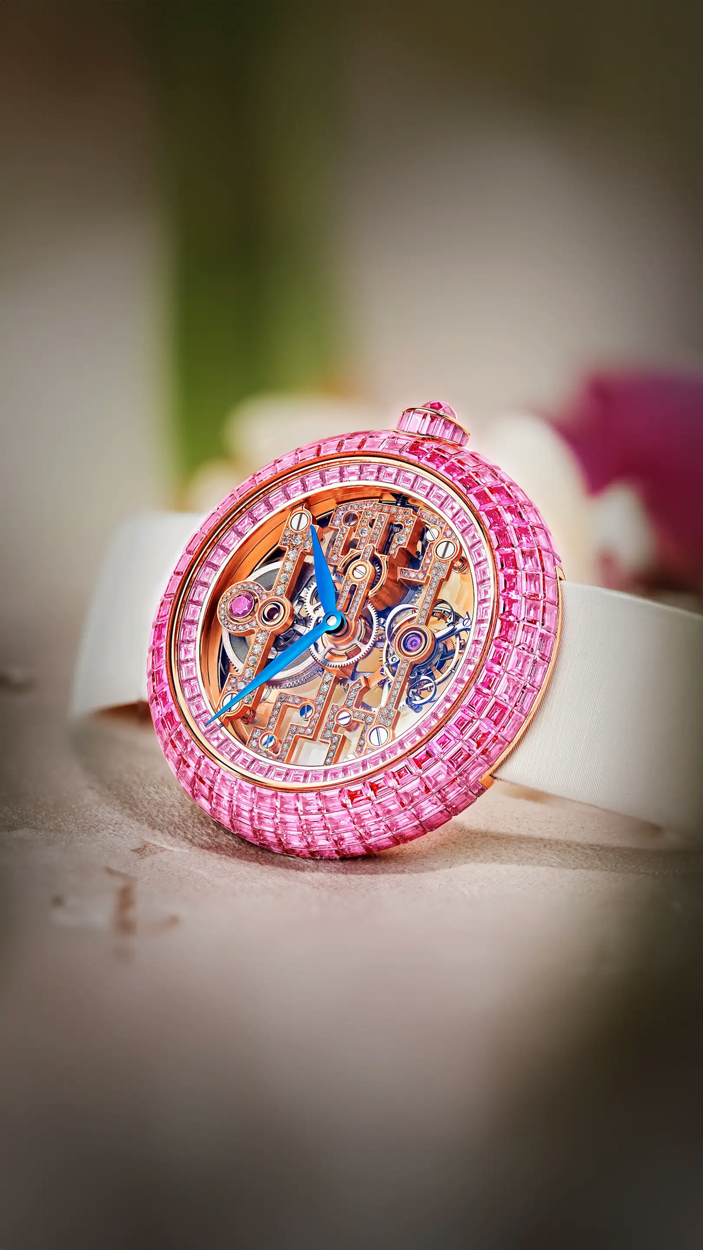 The Pink Sapphire Brilliant Art Deco Tourbillon in rose gold, laid on its side.