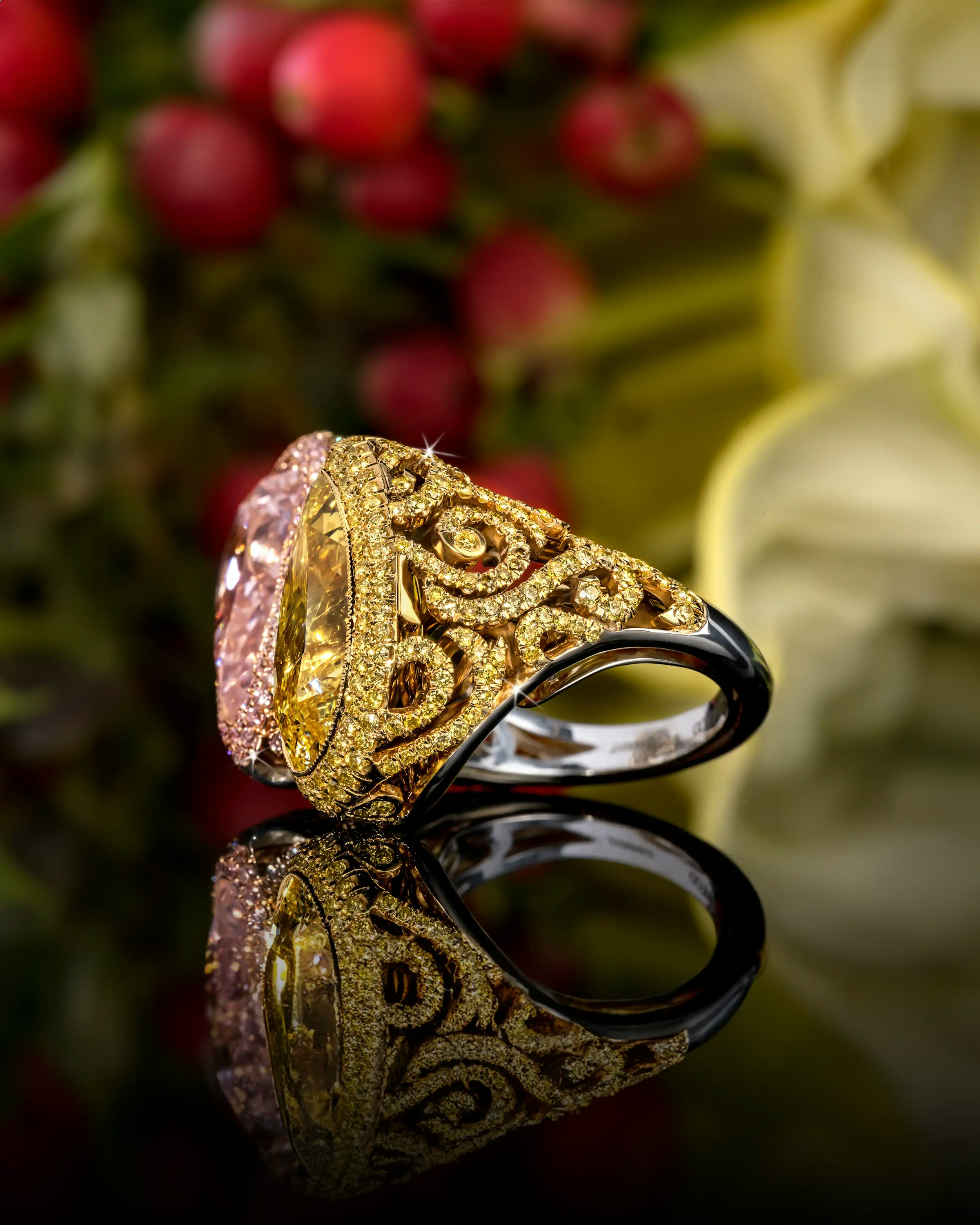 the ring is laid flat on a reflective surface, angled to the lefthand side.