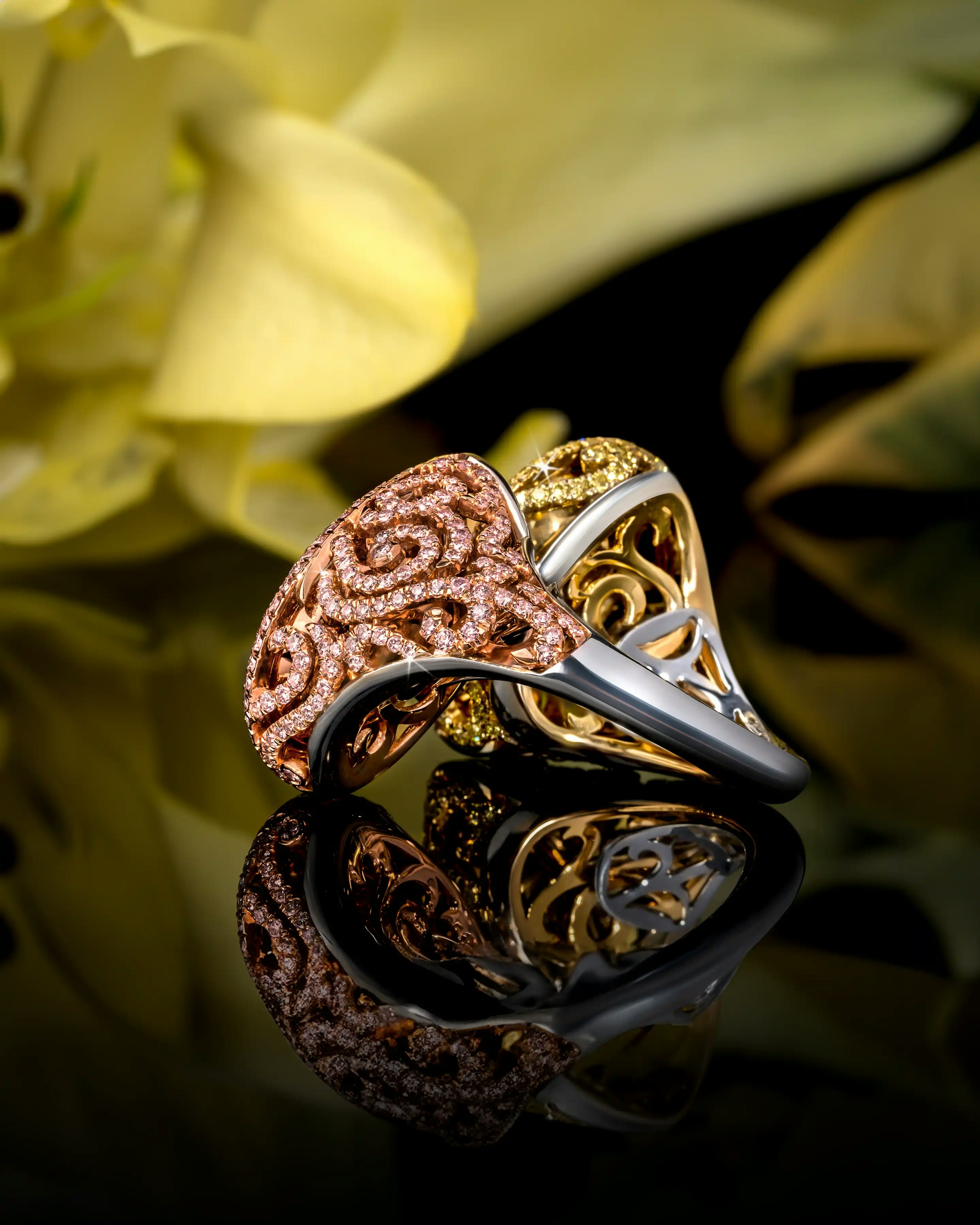 the ring is laid flat on a reflective surface, angled to the righthand side.
