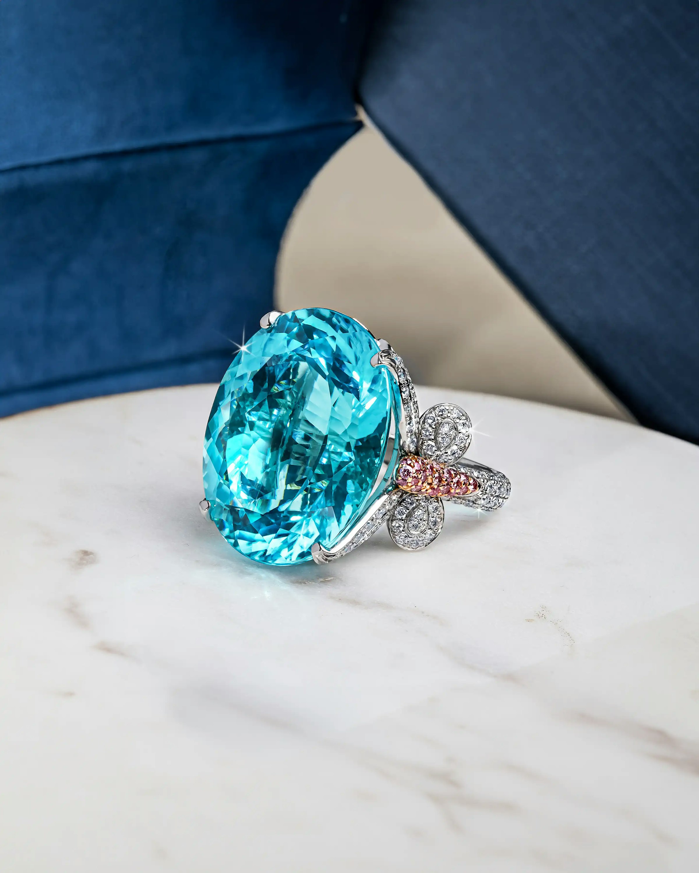 the ring laid flat on a marble surface, tilted to the lefthand side
