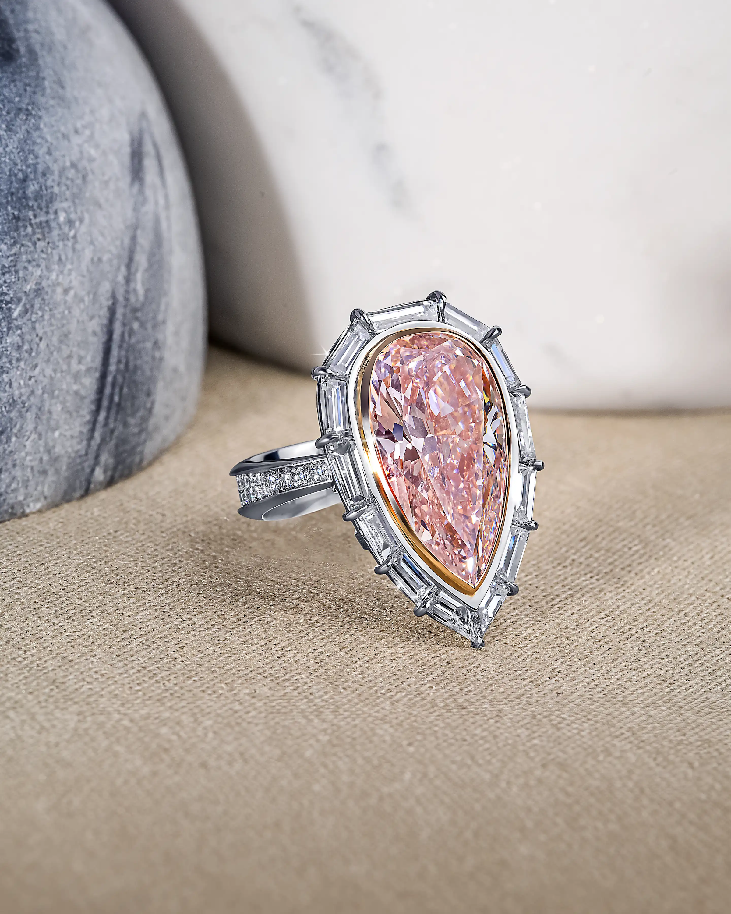 the ring, laid flat on a surface, its pointy end positioned downwards