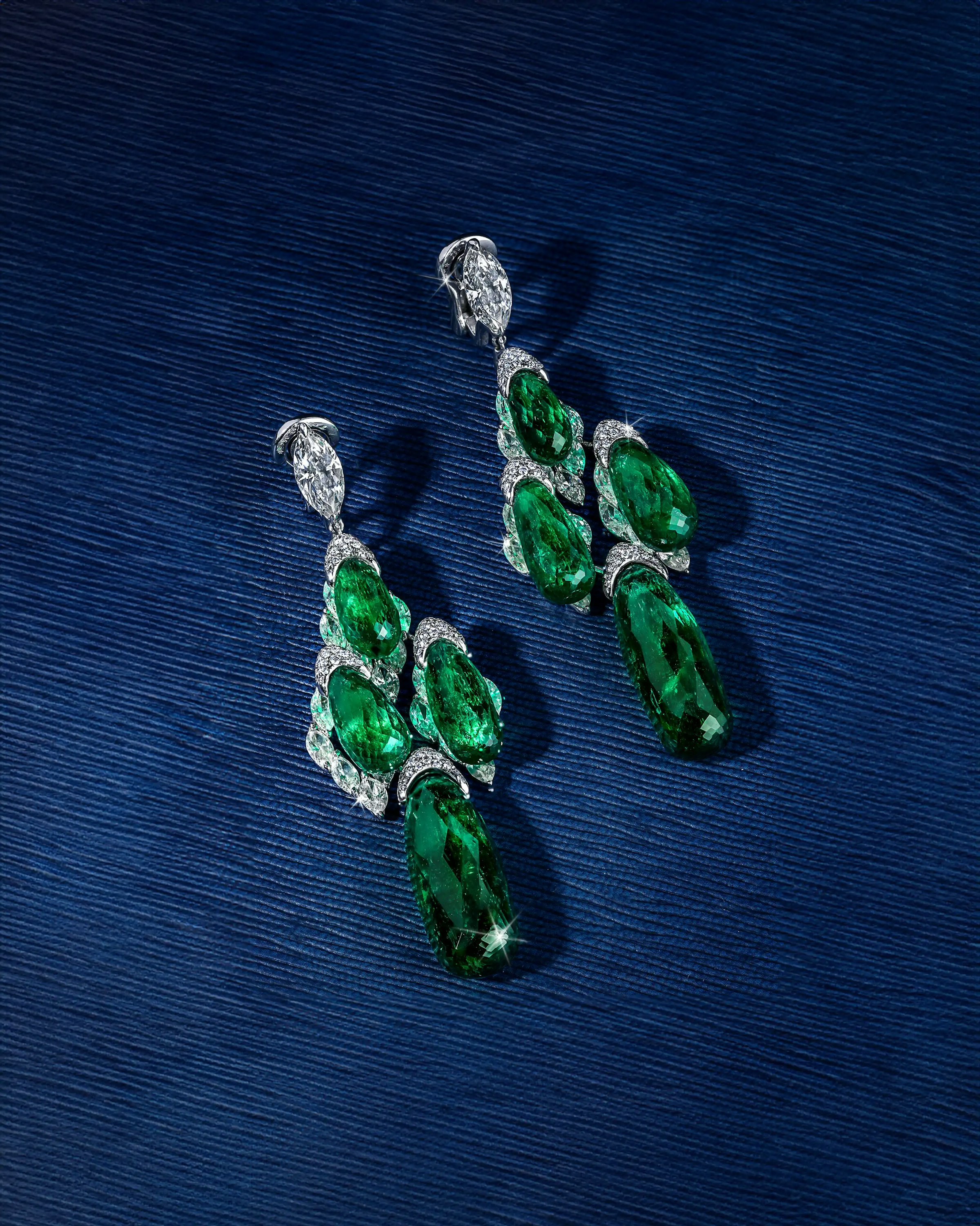 the earrings, laid flat, tilted to the right