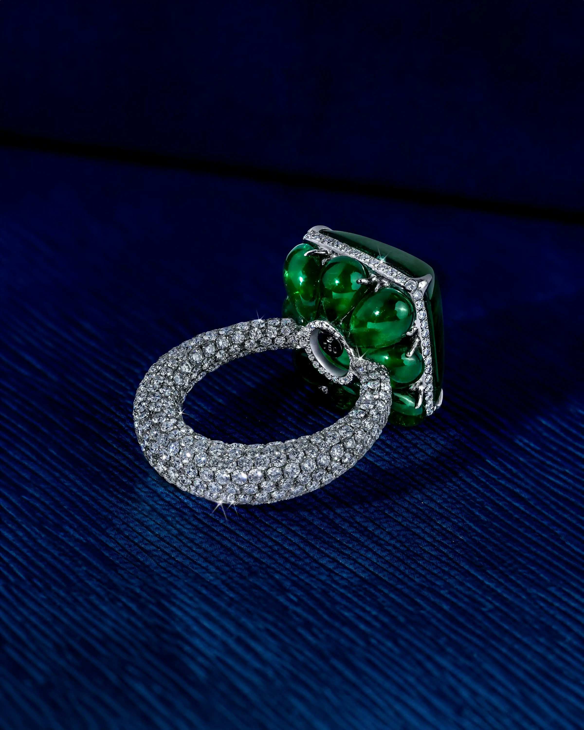 the ring, with its band facing the viewer, showing the pave set
