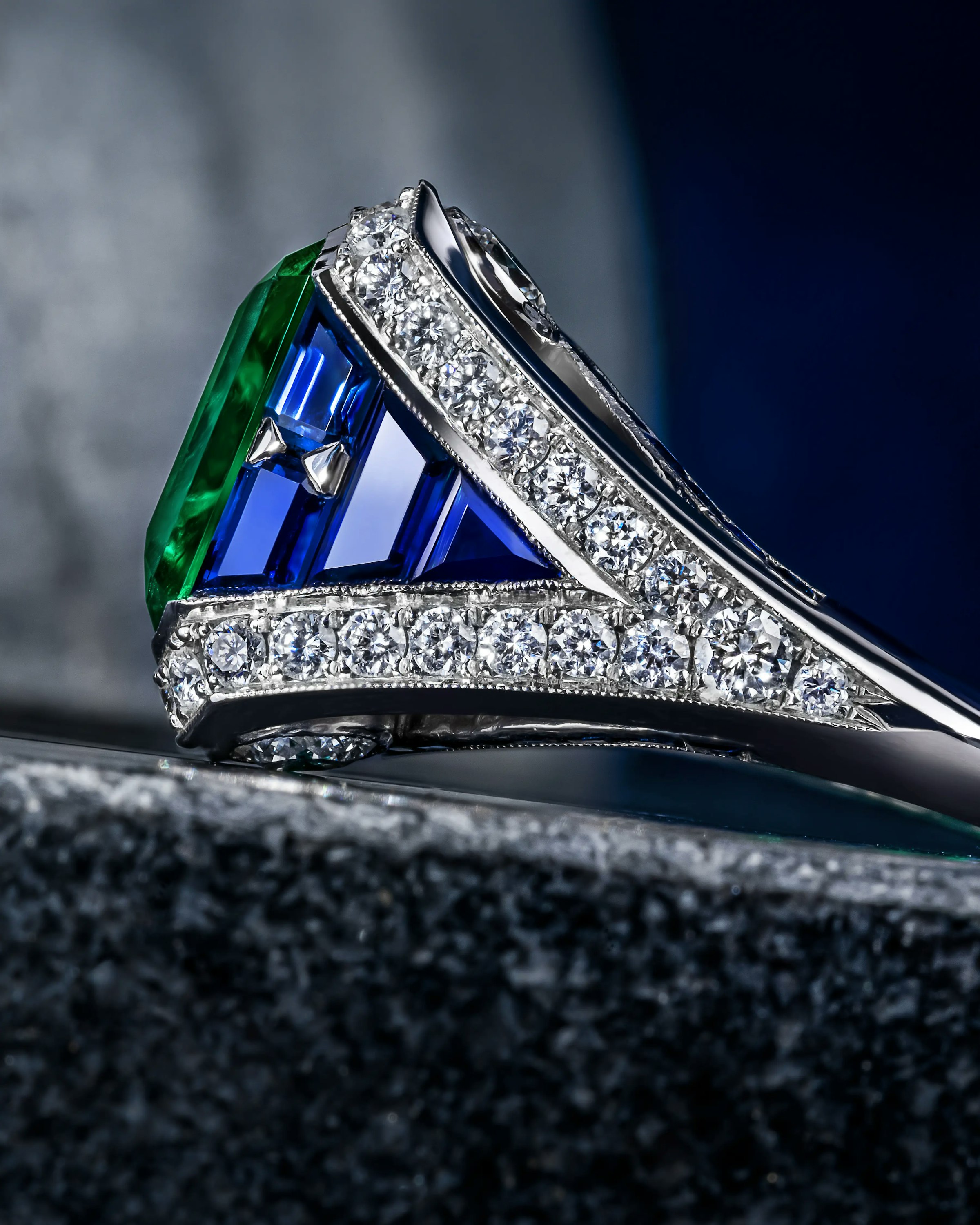 close up of the eye of the emerald ring, showing the sapphires.