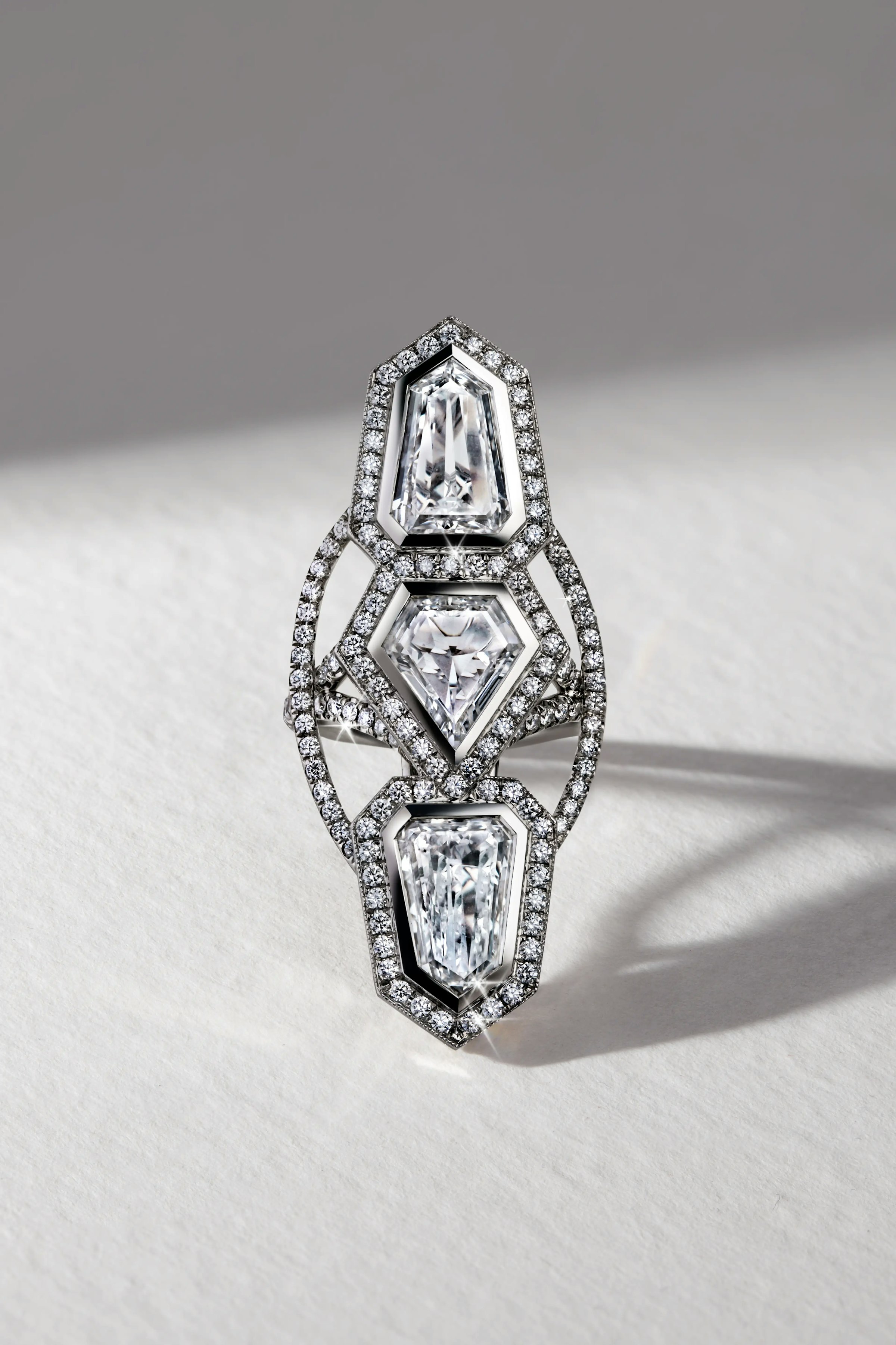 the annika white diamond ring, laid flat on a surface.