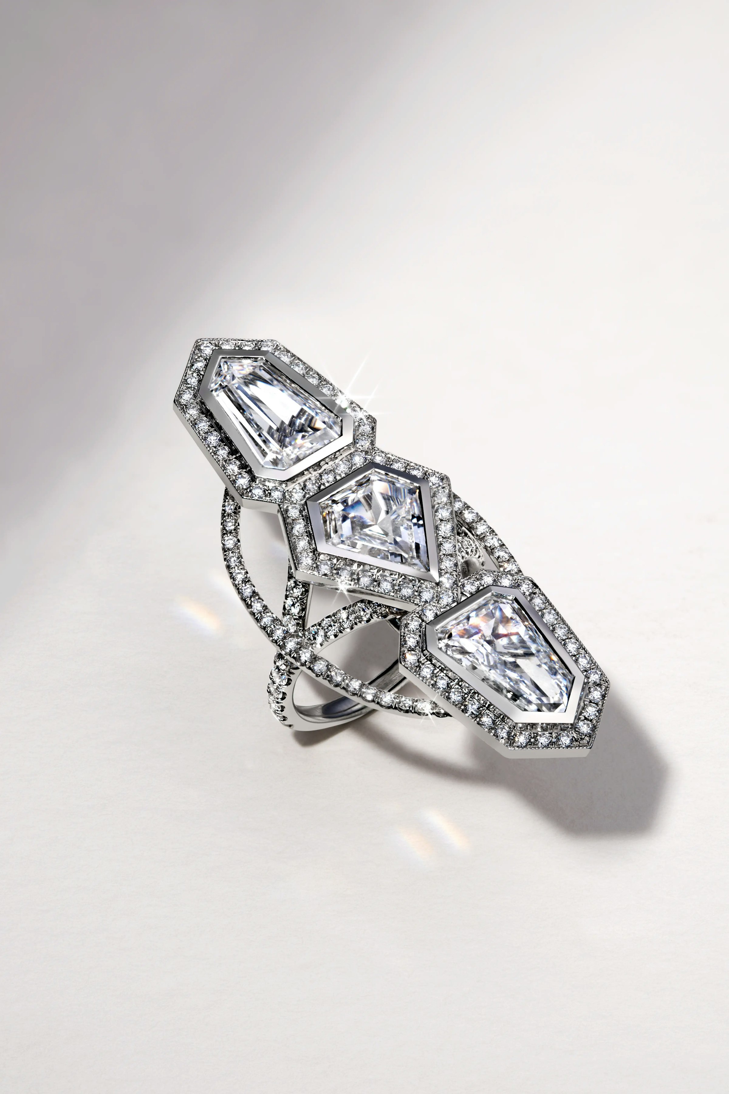 the annika white diamond ring, laid flat on a surface.