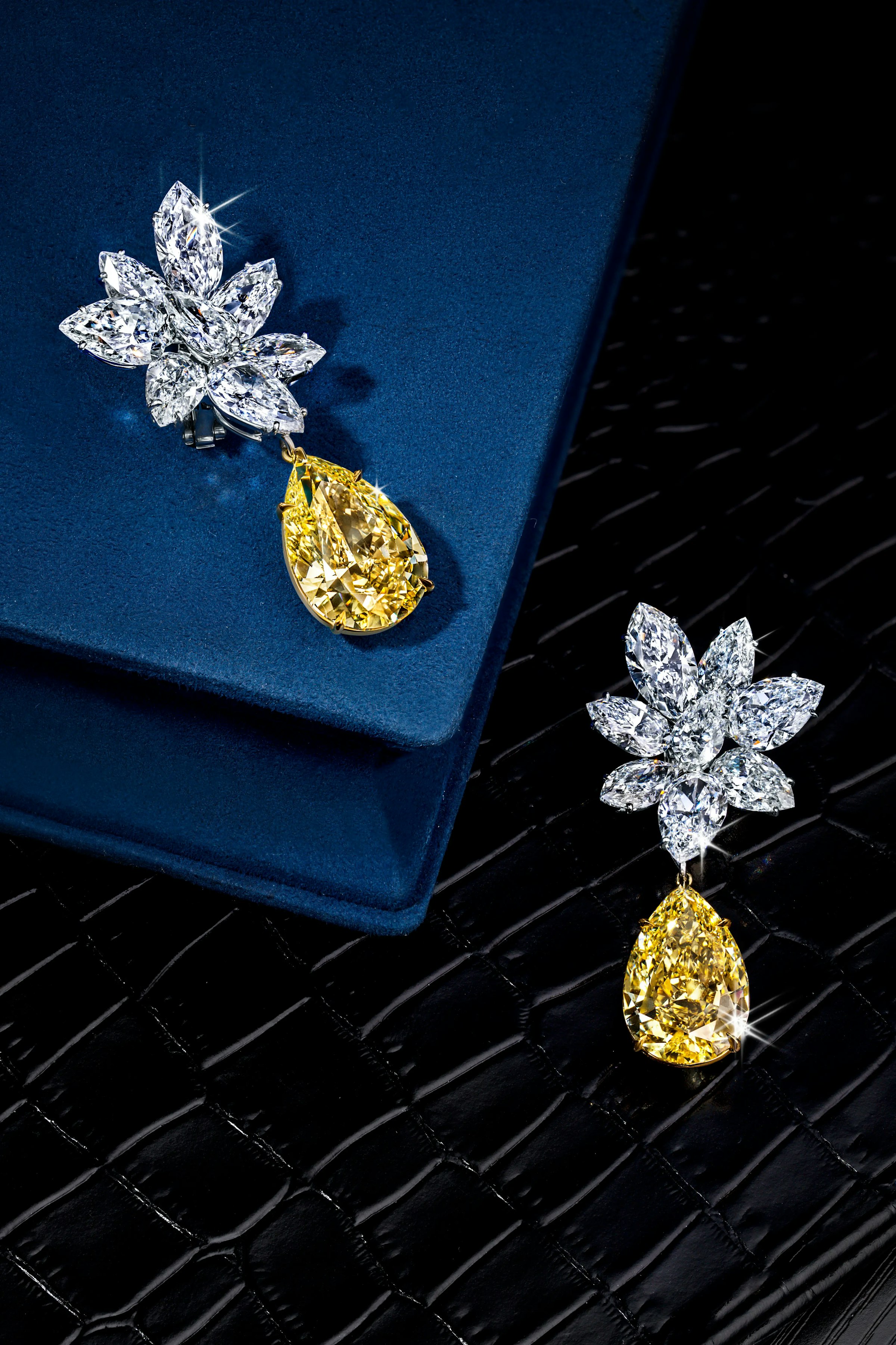 the yellow garden earrings, laid flat on a different surface.
