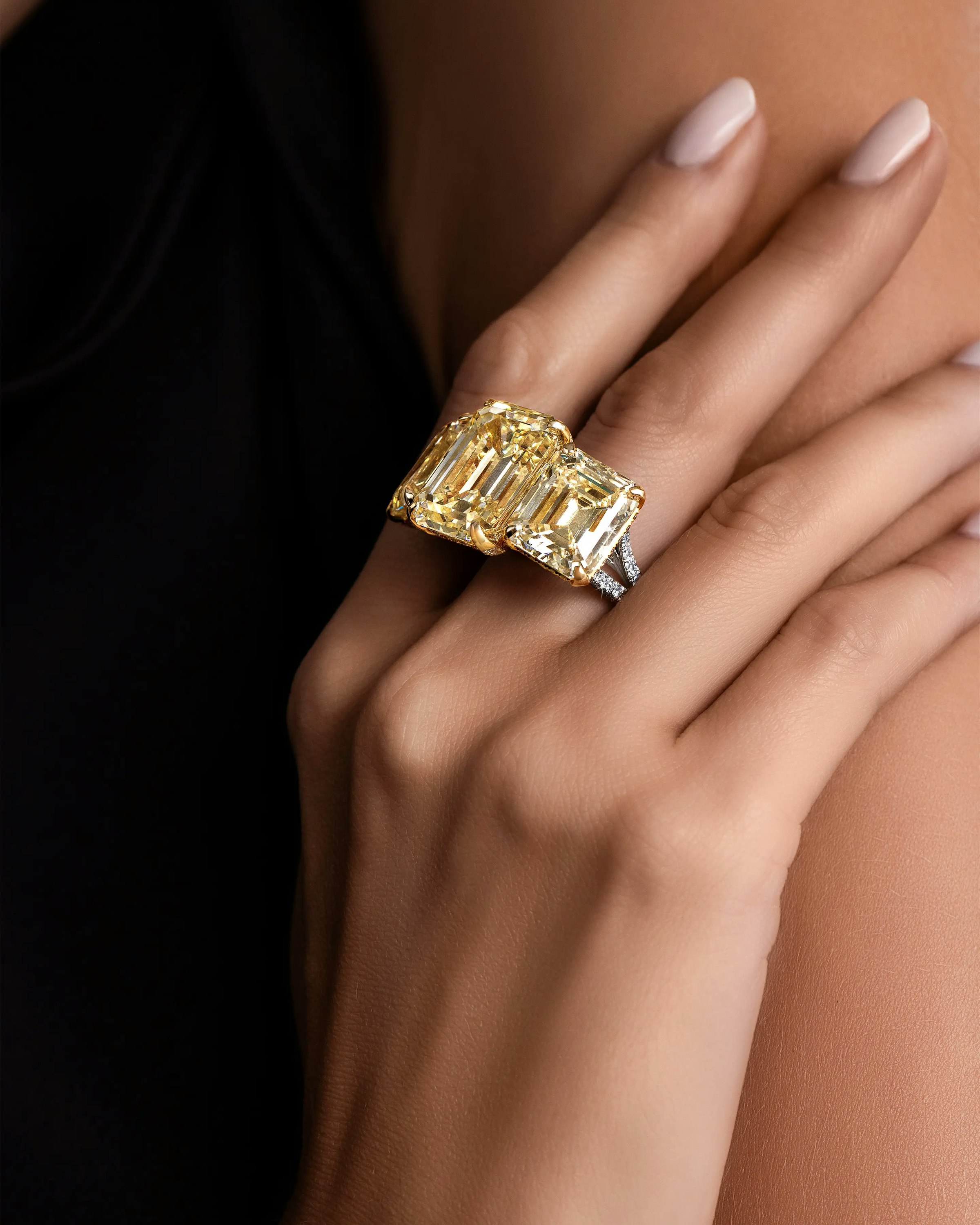 a model wears the three diamond suns ring.