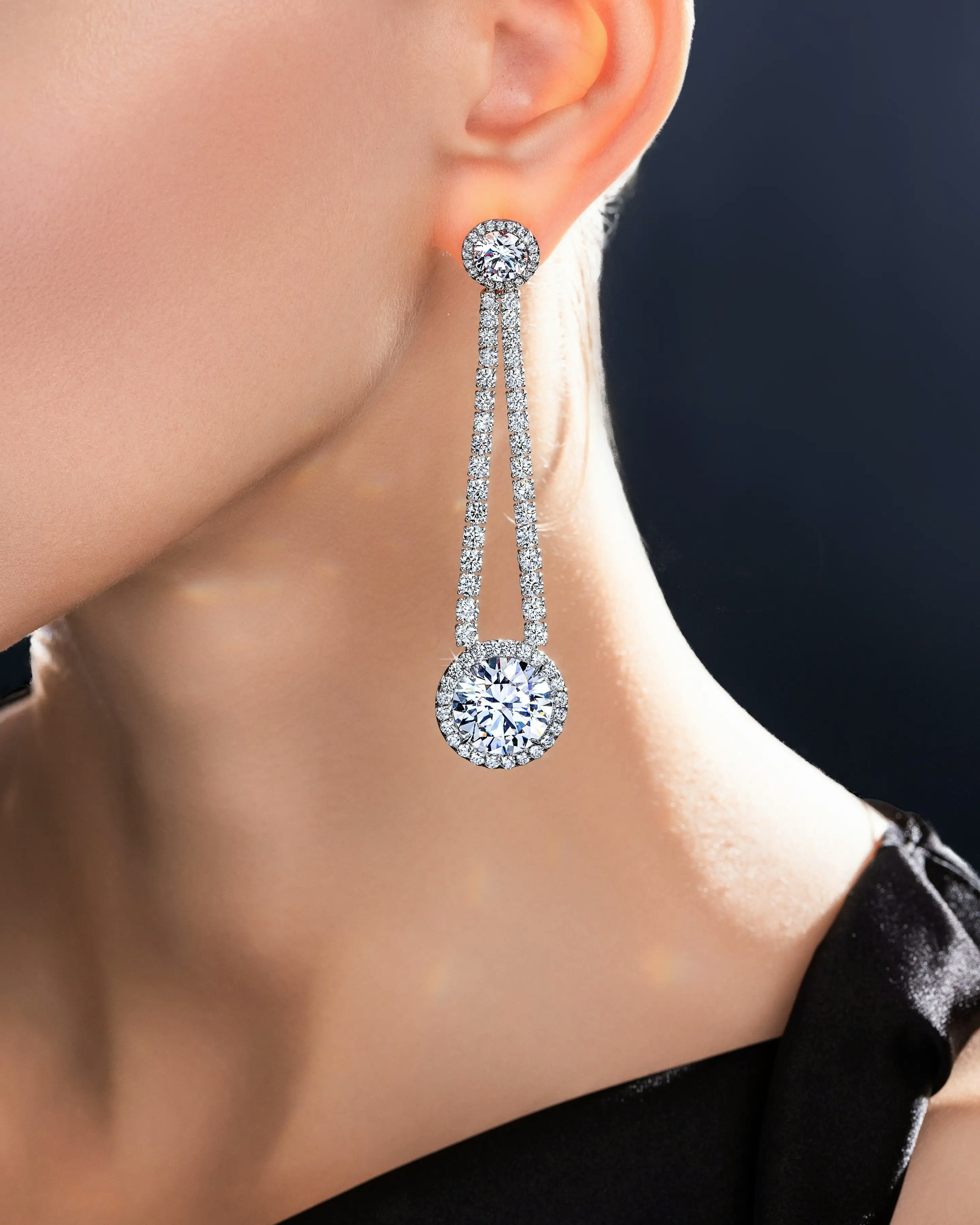 another image of a model wearing the dew drop earrings.