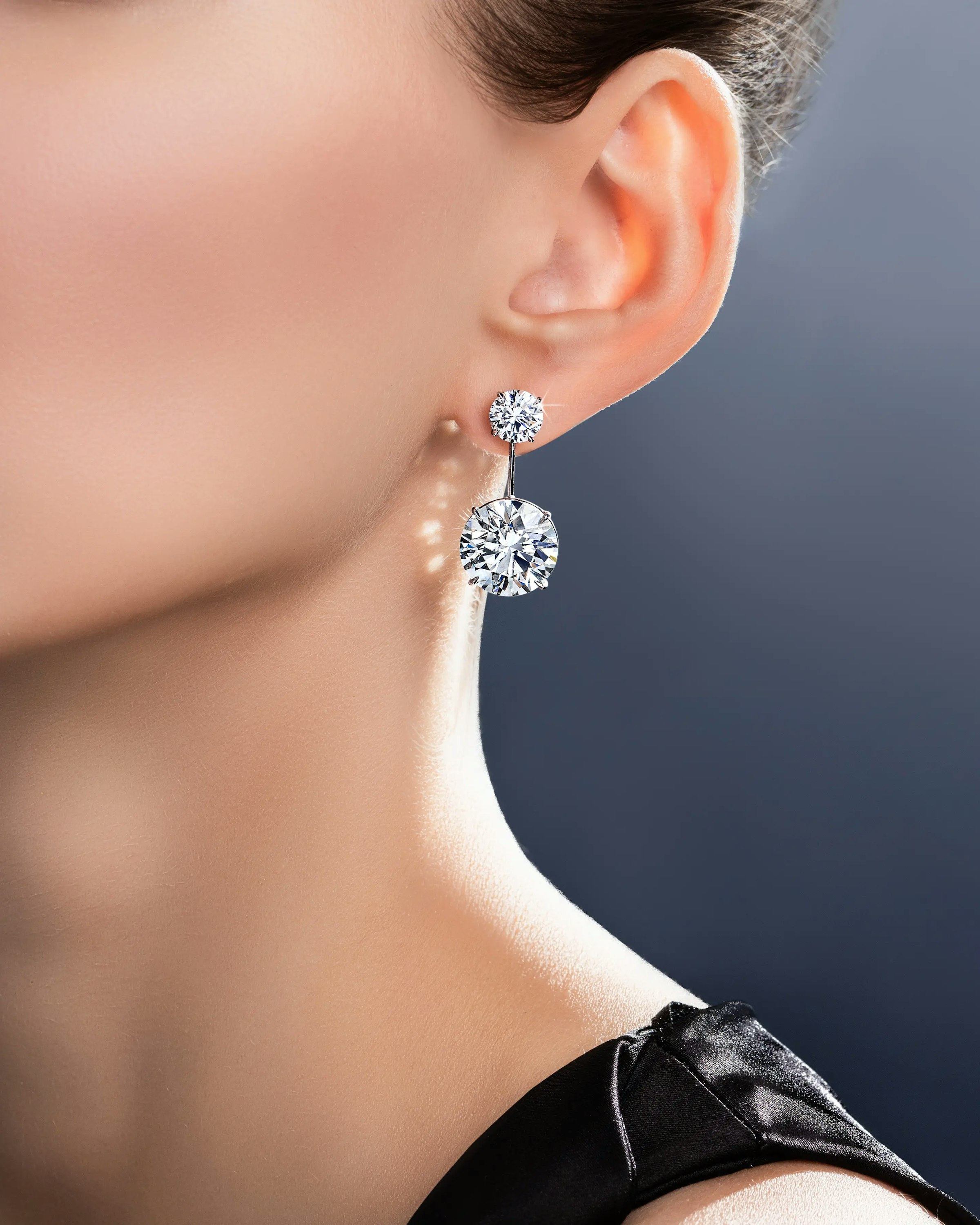 a model wears the brilliant riviera earrings.