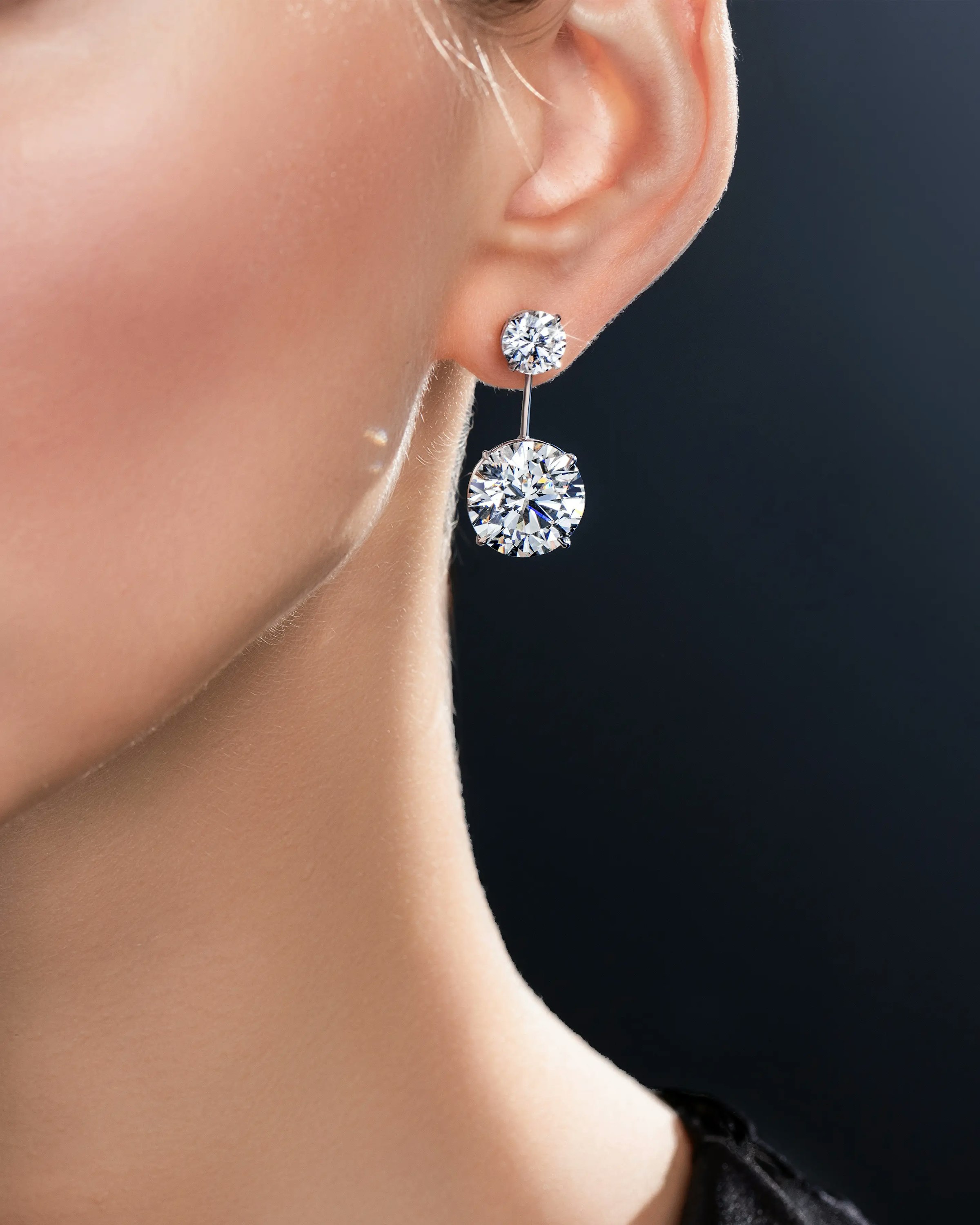 a model wears the brilliant riviera earrings.