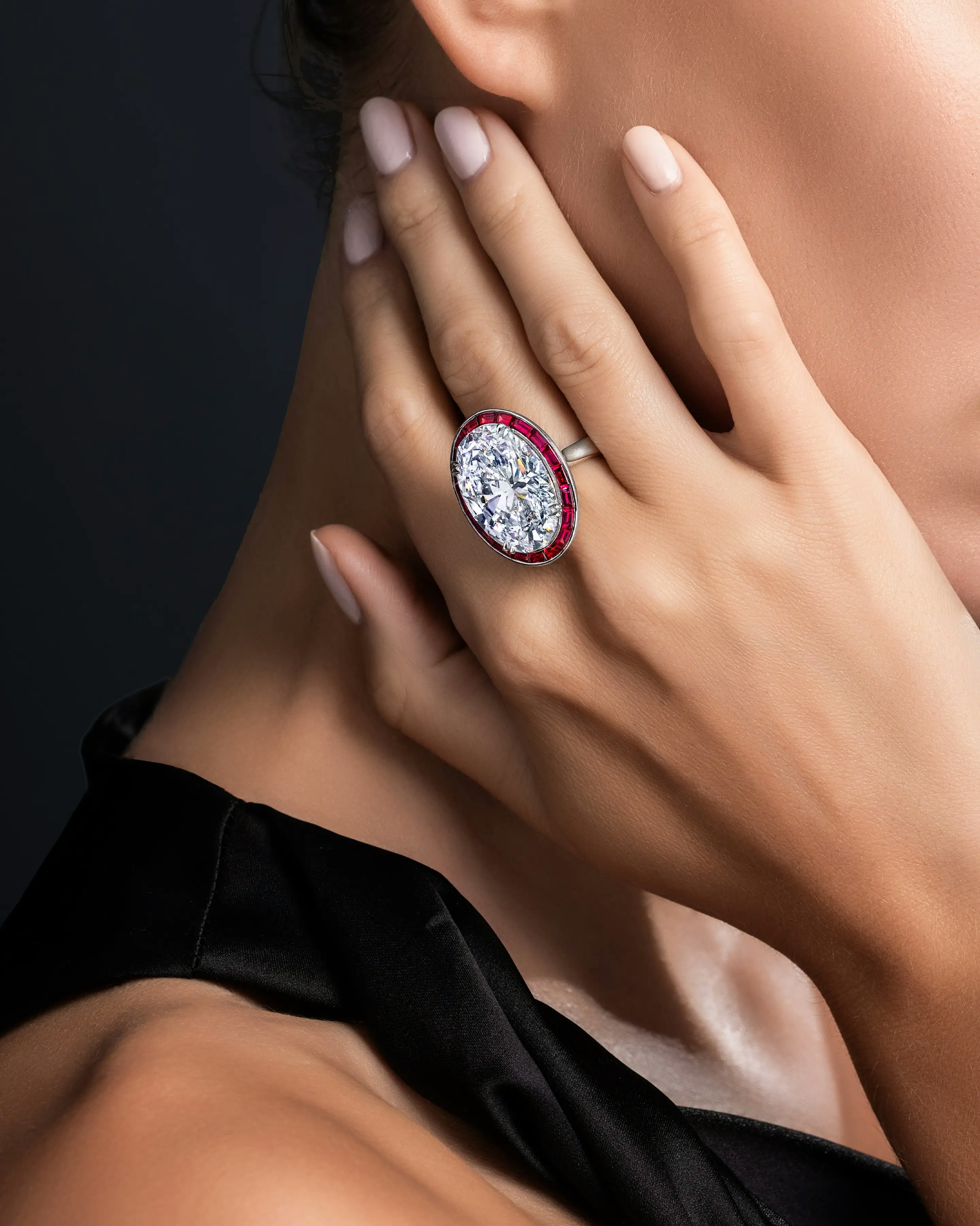 a model wears the crimson ice ring.