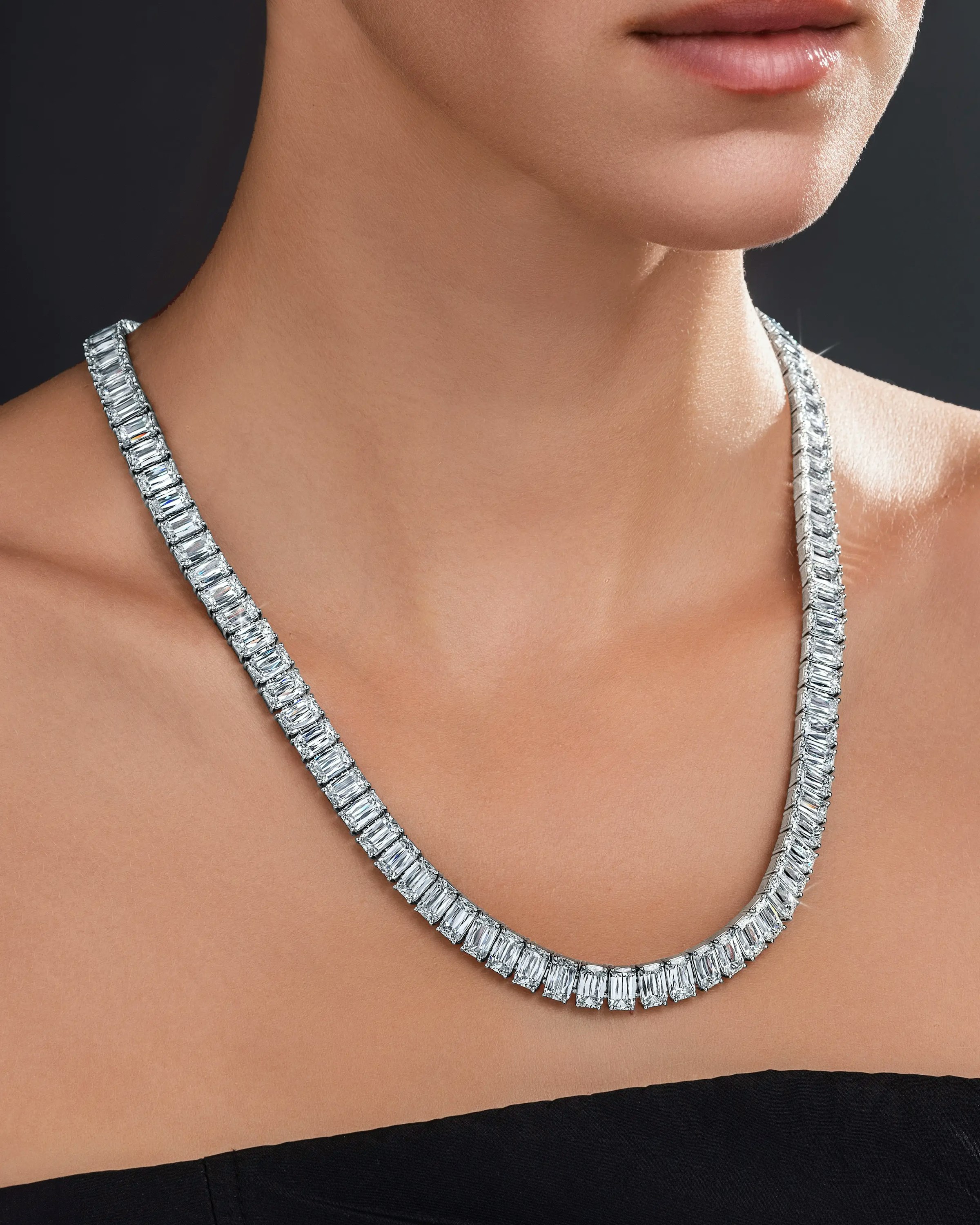 a model wears the ashoka diamond tennis necklace.