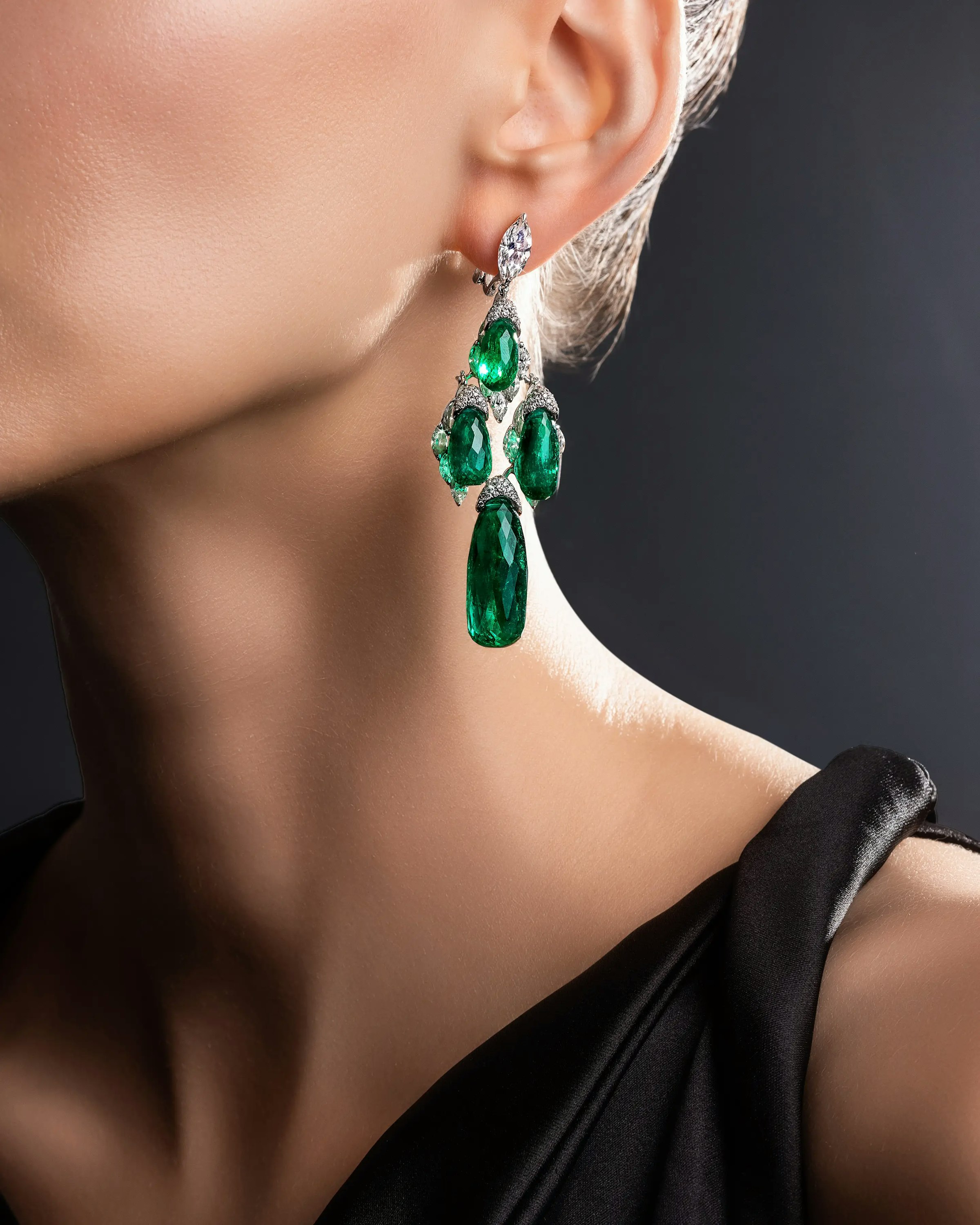 a model wears the evergreen dynasty earrings.