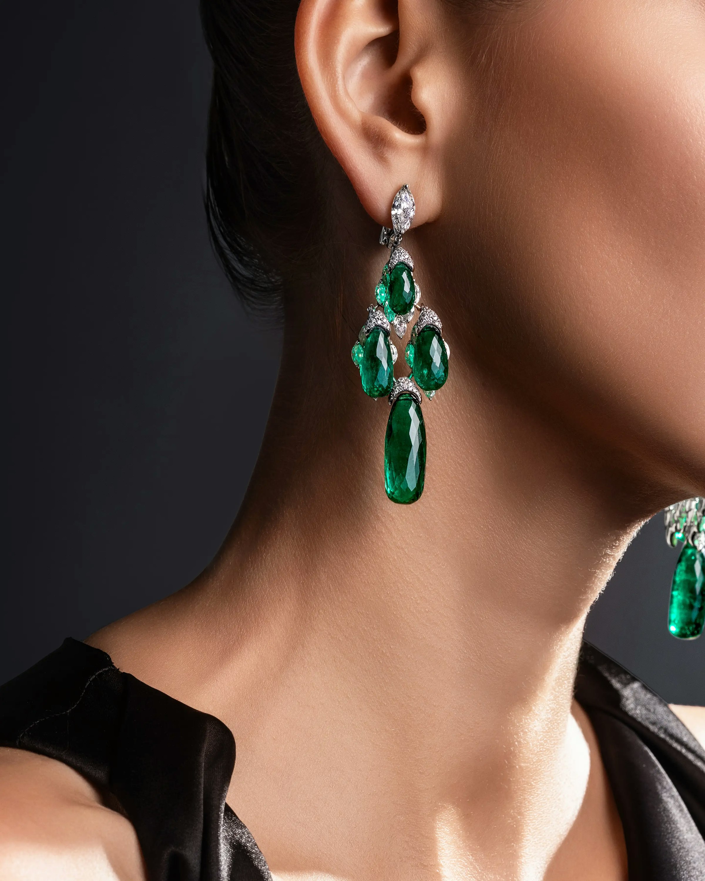 a model wears the evergreen dynasty earrings.