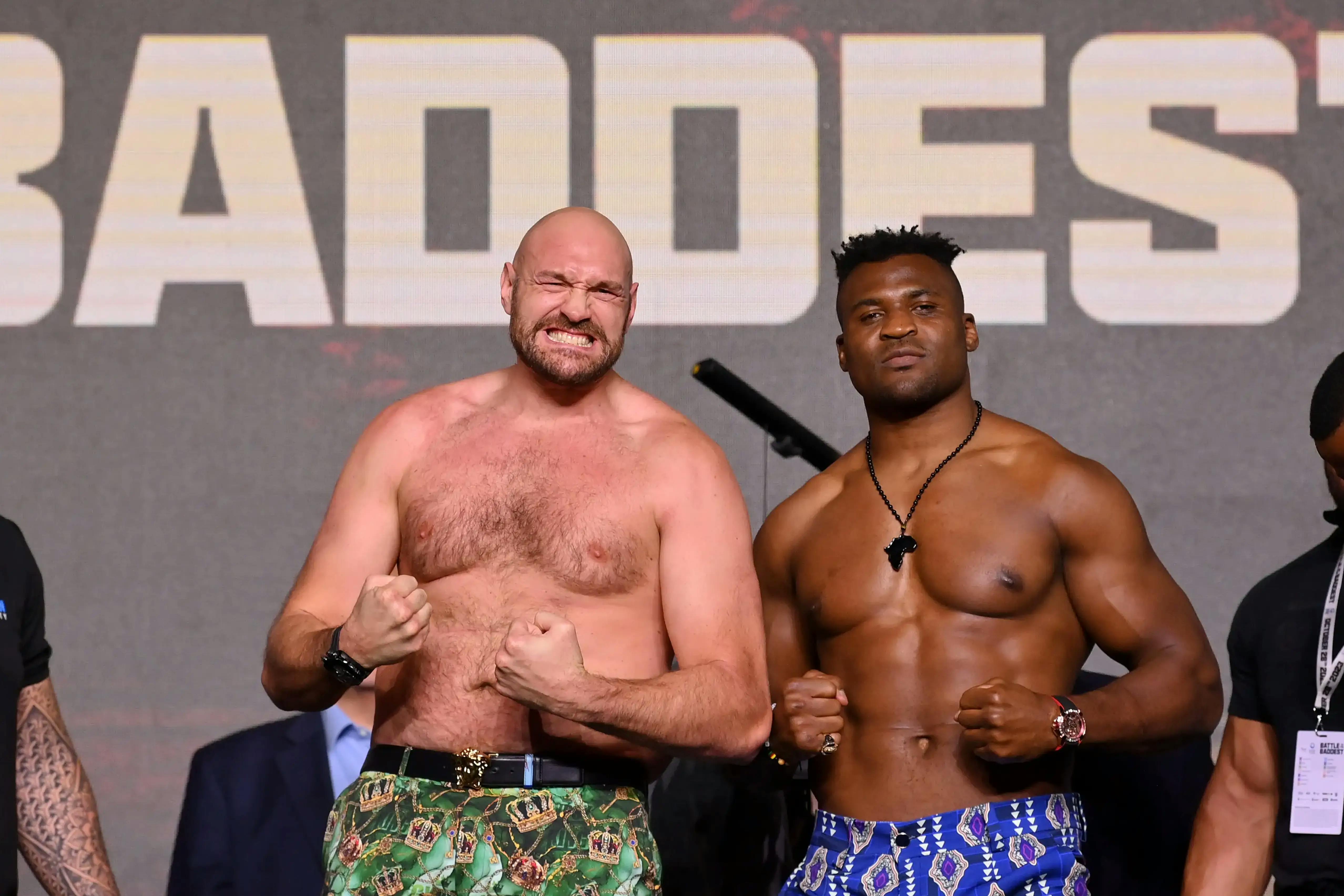 Image of two men with their clenched fists up