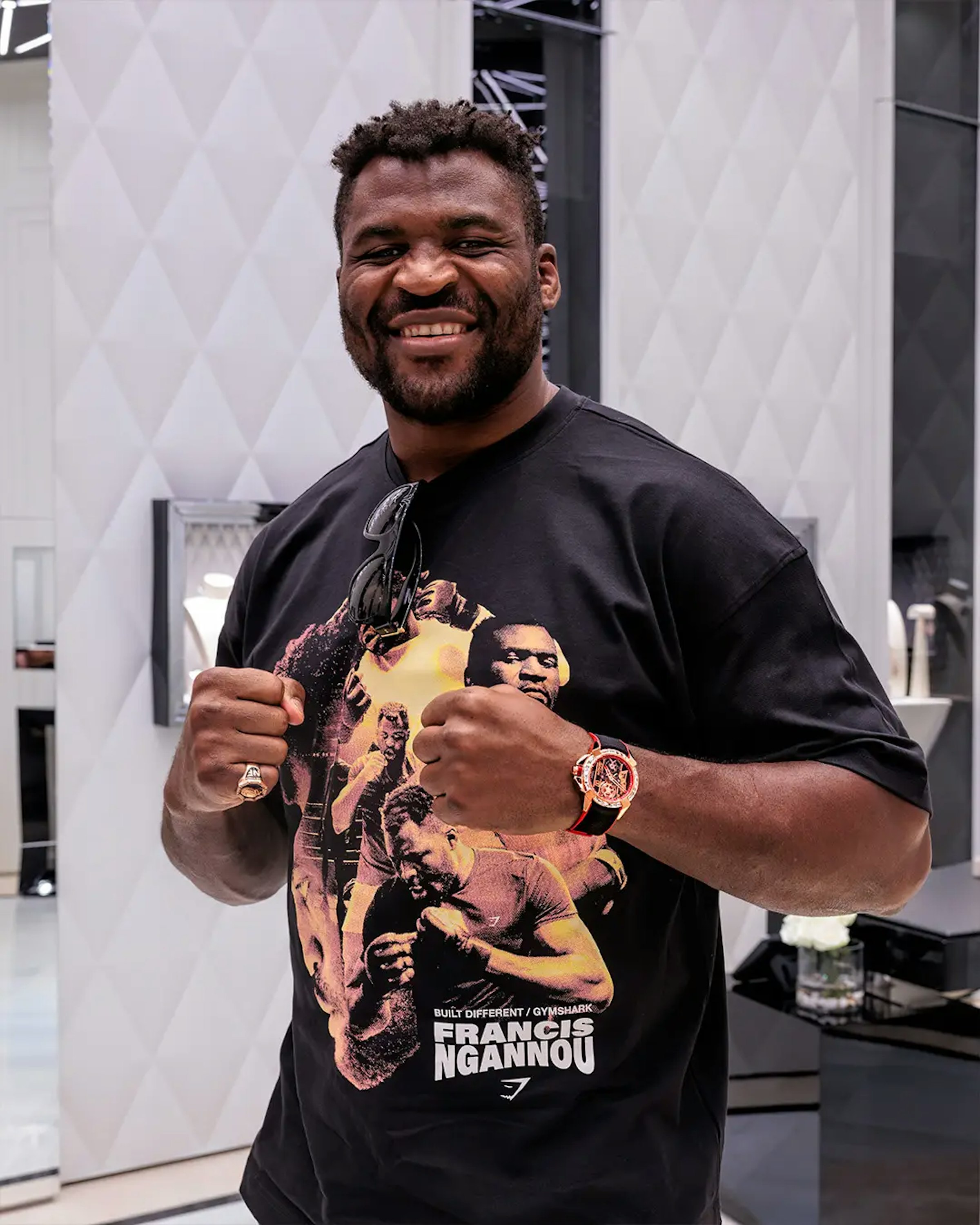An image of man with his fists up wearing a watch on his left wrist