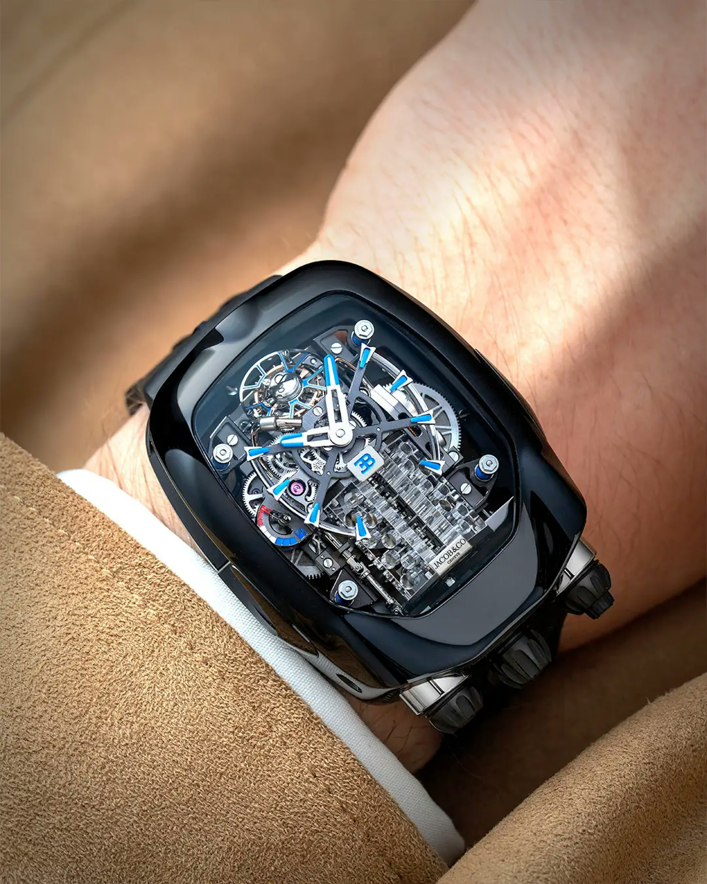 An image of a black watch on the wrist