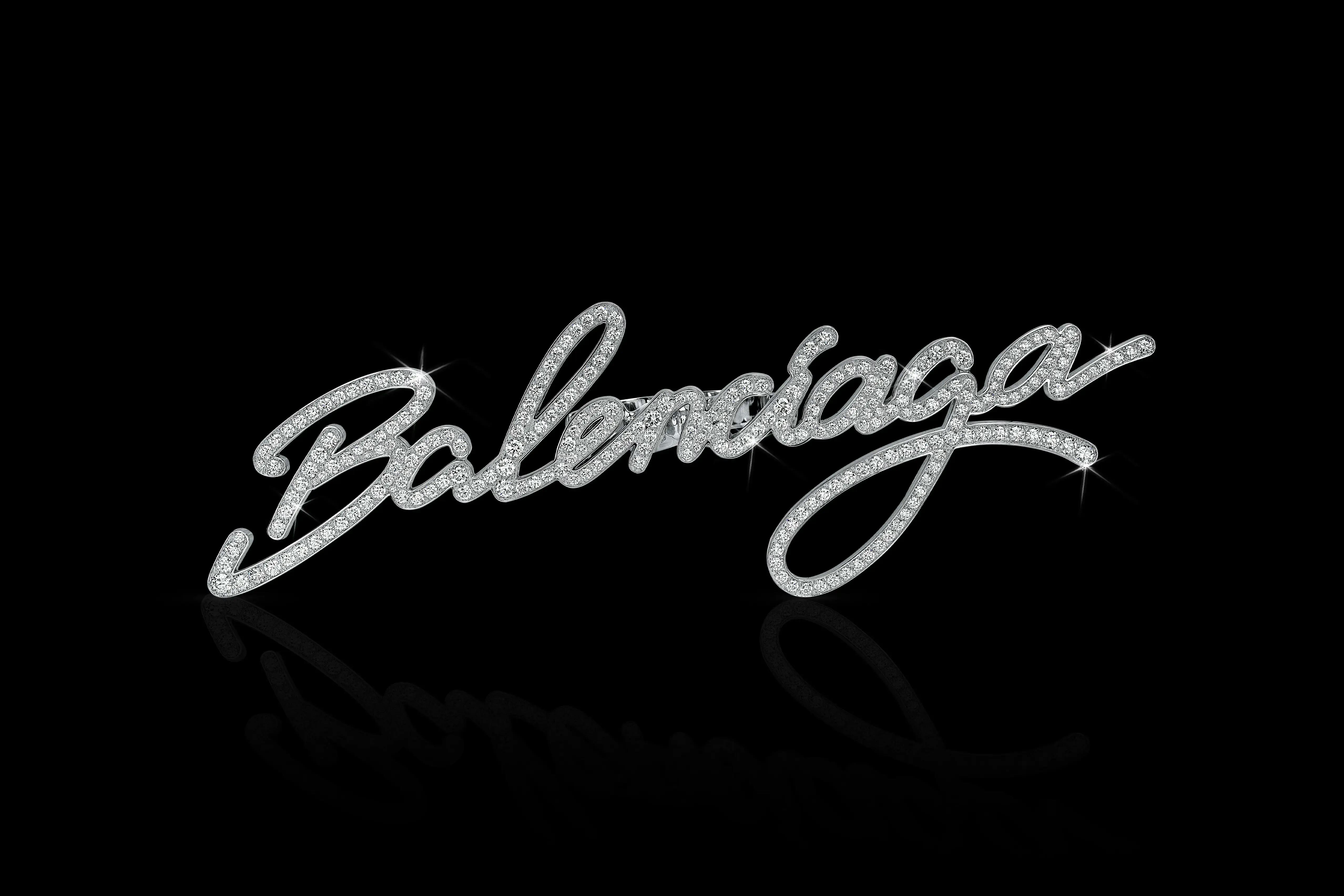 Image of a diamond-studded Balenciaga word written in cursive