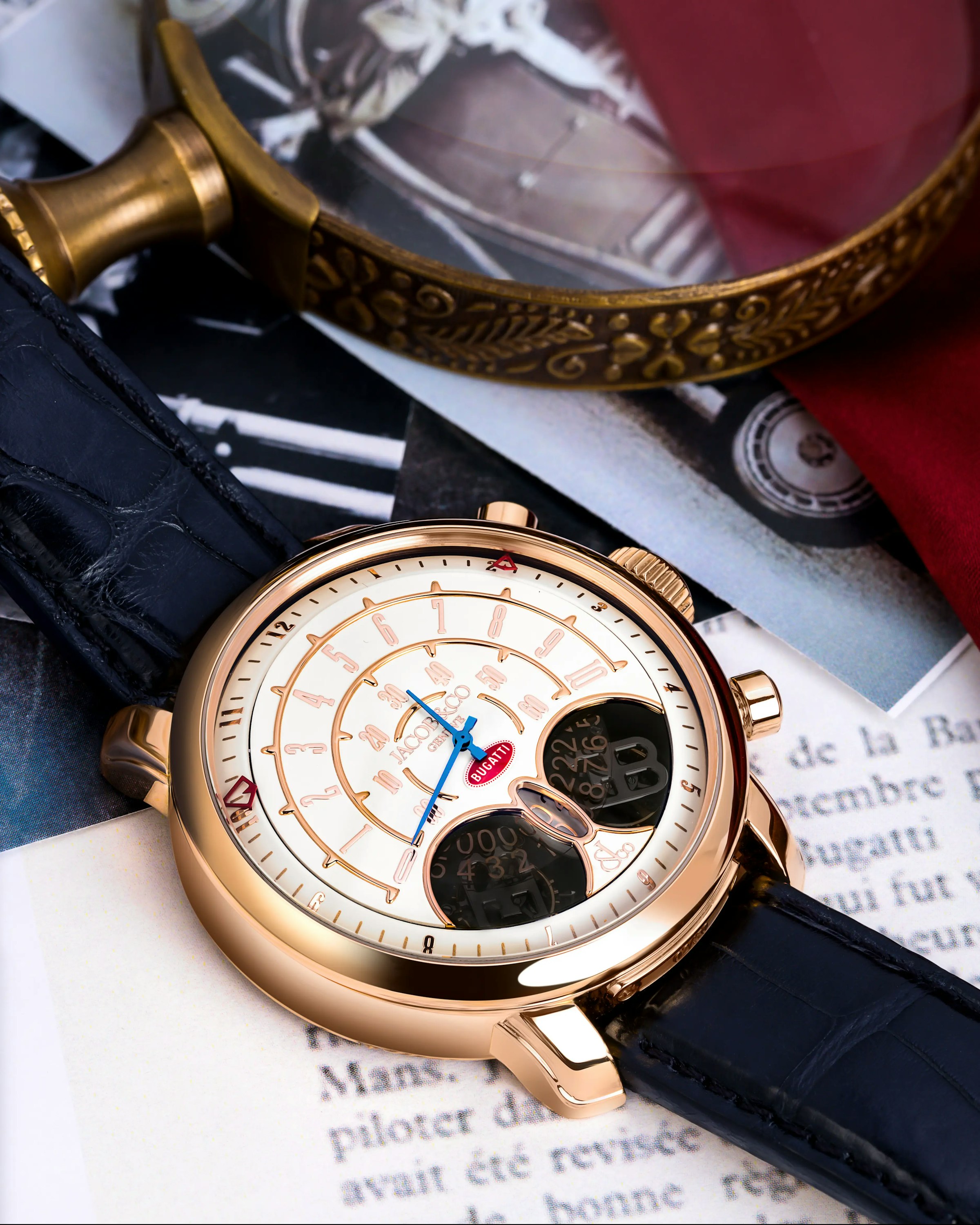 An image of the Jean Bugatti rose gold watch laid flat on a surface