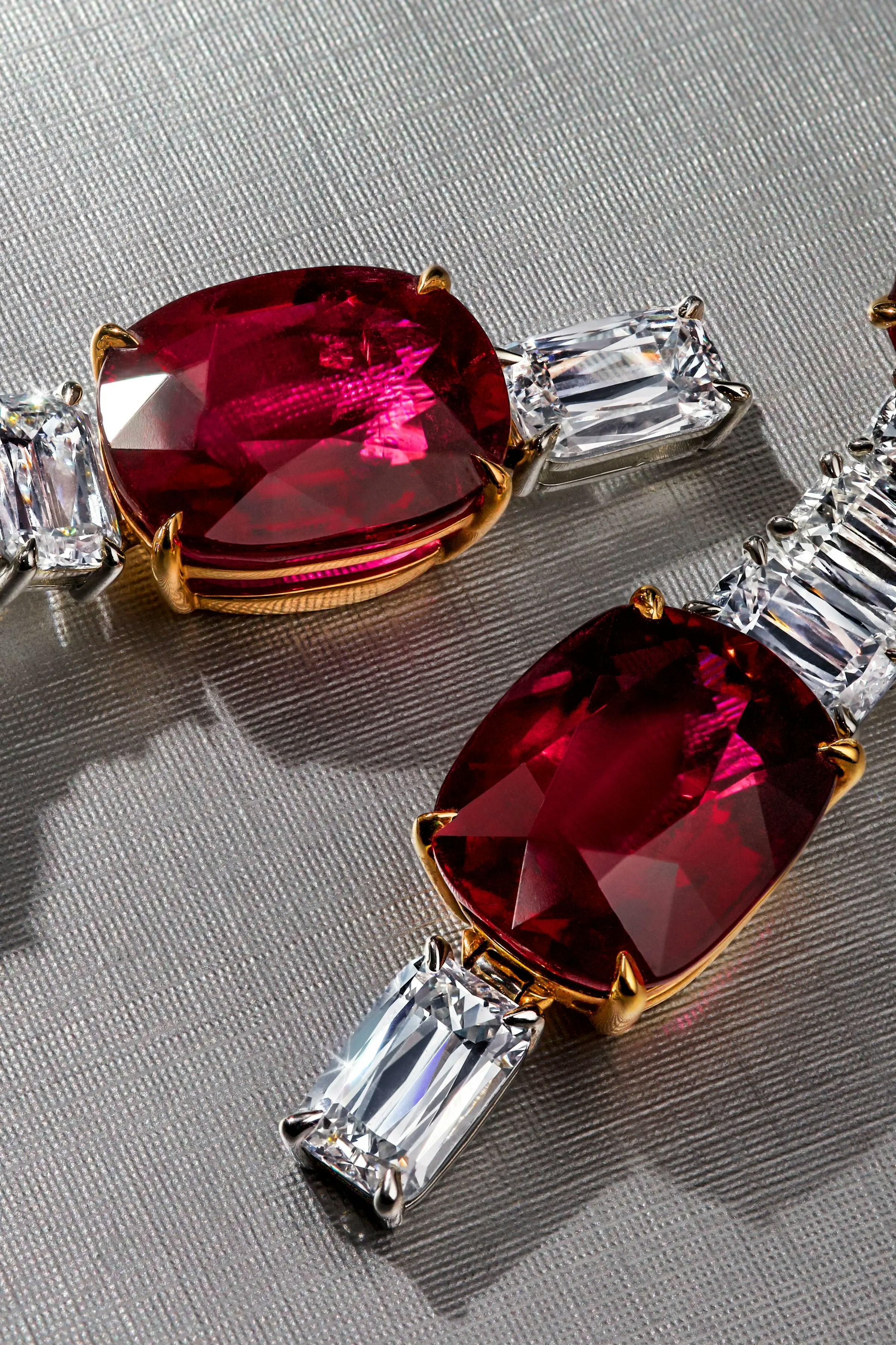 the crimson cascade earrings, laid flat on a surface.
