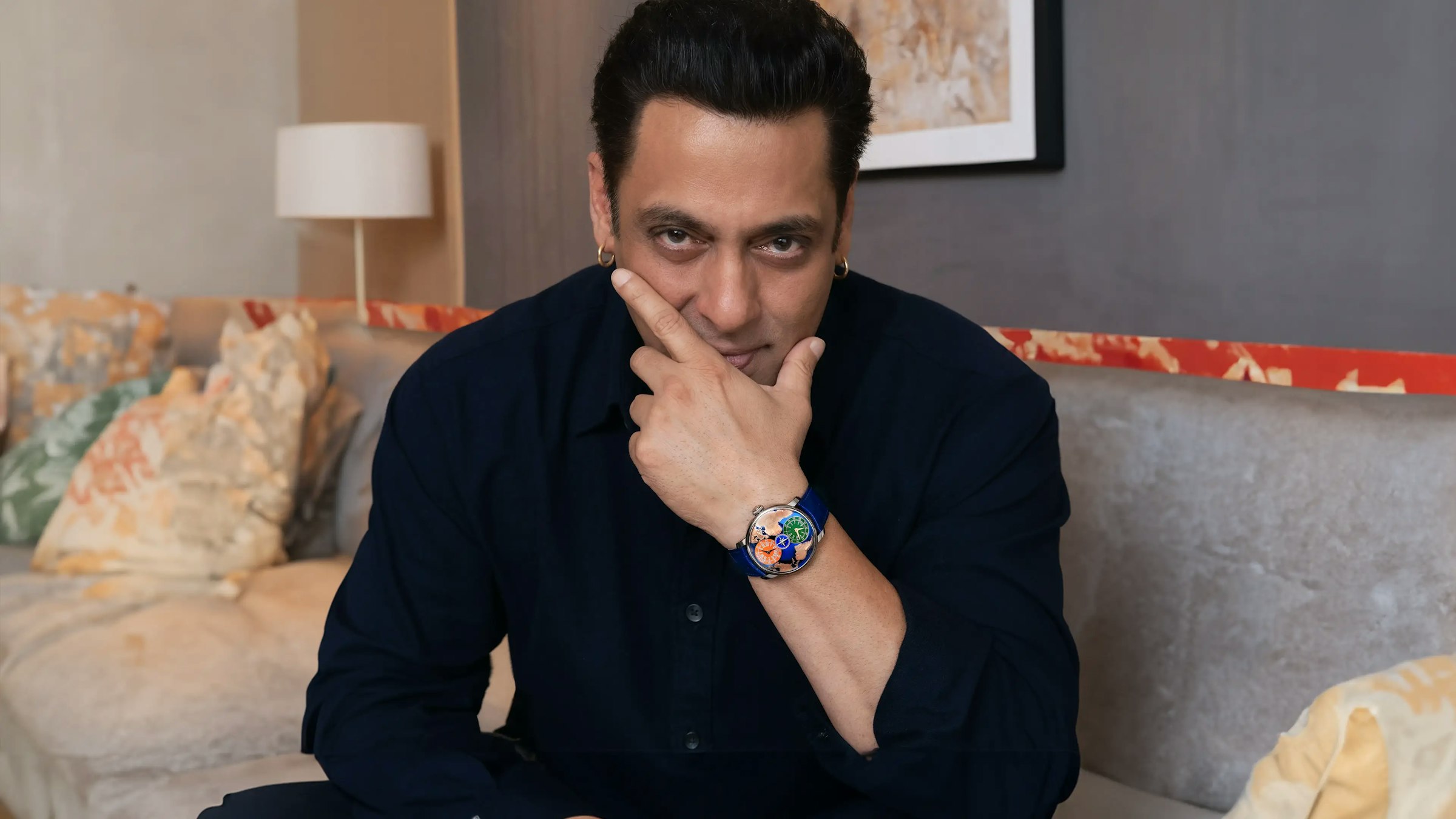 salman khan smiles and poses as he wears the dual time zone salman khan watch.