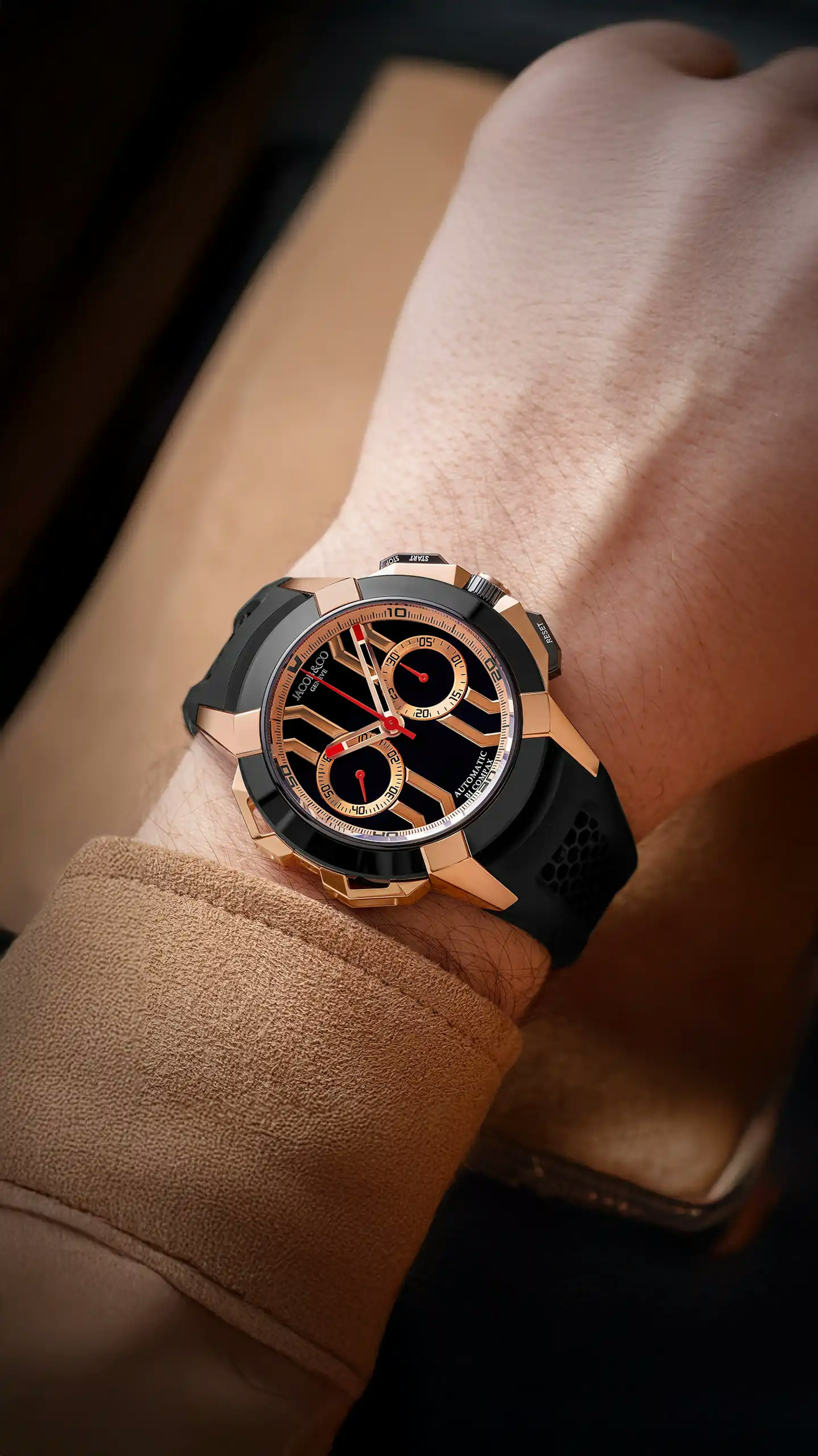epic x chrono 44MM watch in black titanium and rose gold accents, worn on the left wrist
