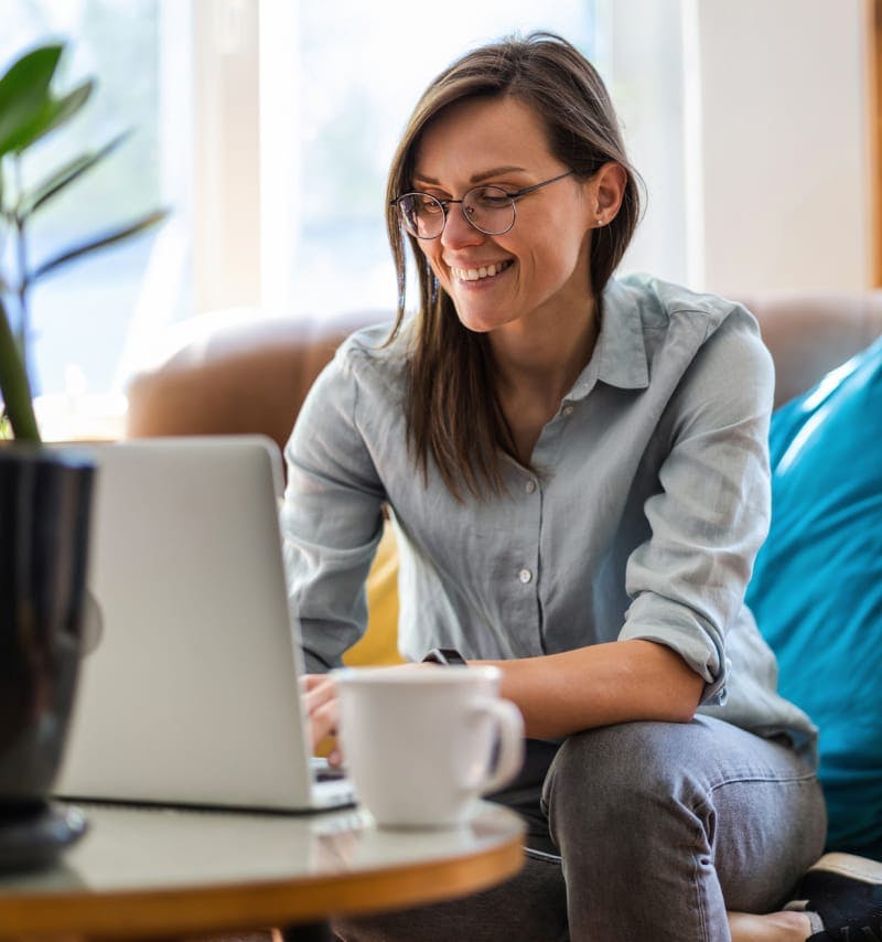 Woman smiling while on her computer