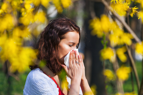 woman sneezing