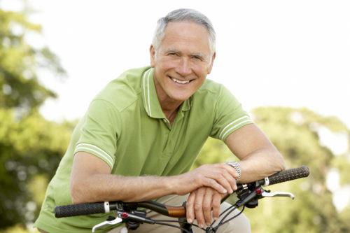 A man sitting on a bike 