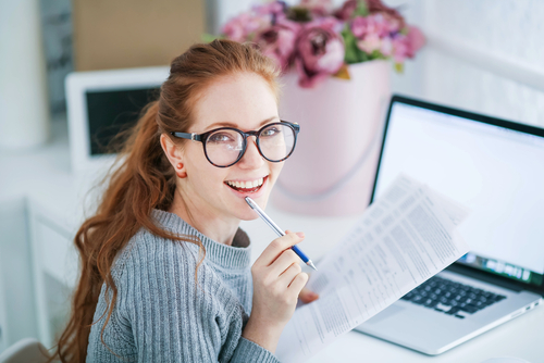 Smiling Young Woman Wearing Glasses