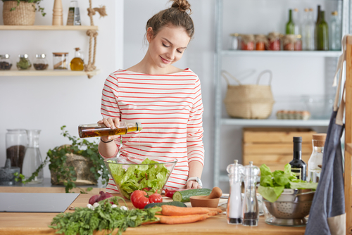 Young woman cooking after LASIK