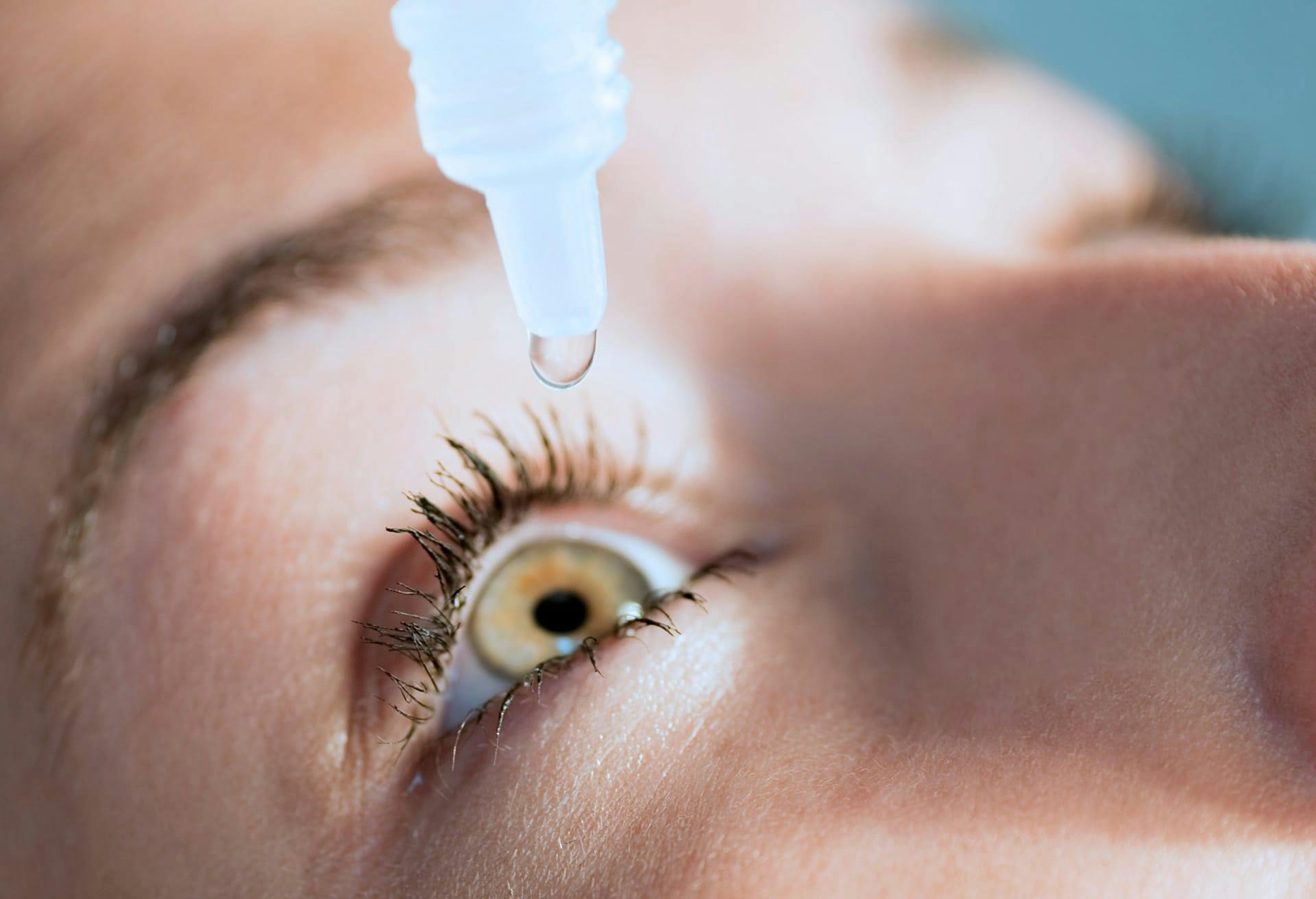 woman getting eye drops