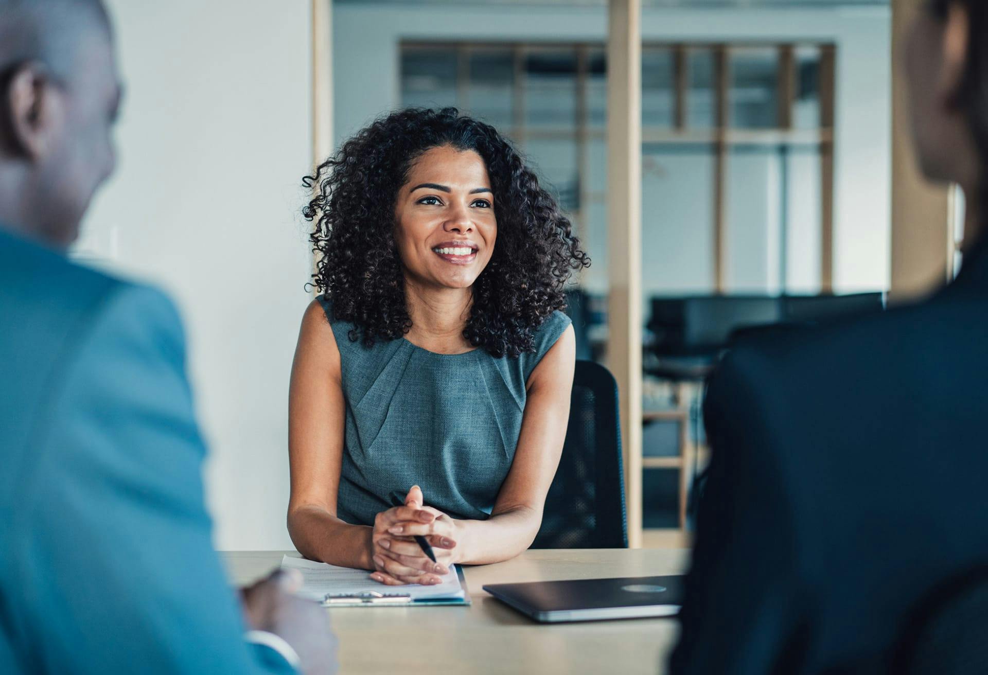 people talking at a desk