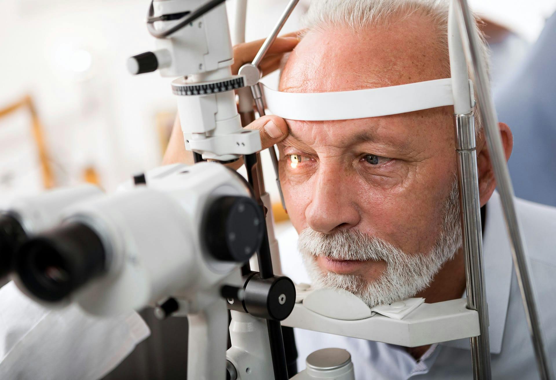 man having eyes examined