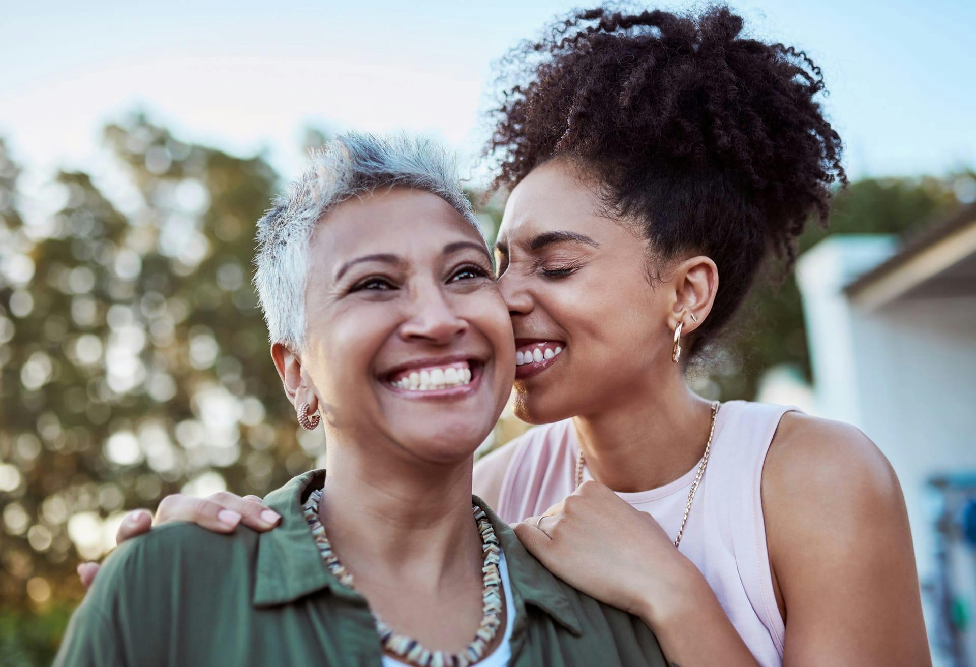 mother and daughter smiling