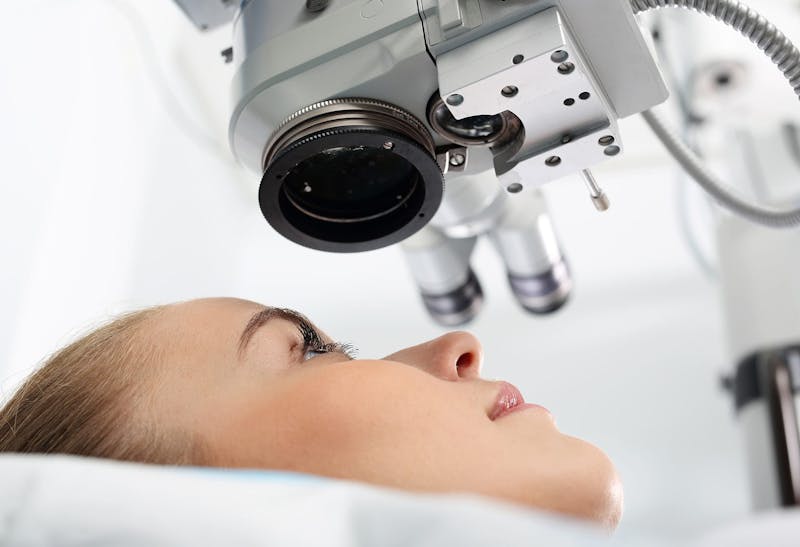 Woman receiving LASIK surgery