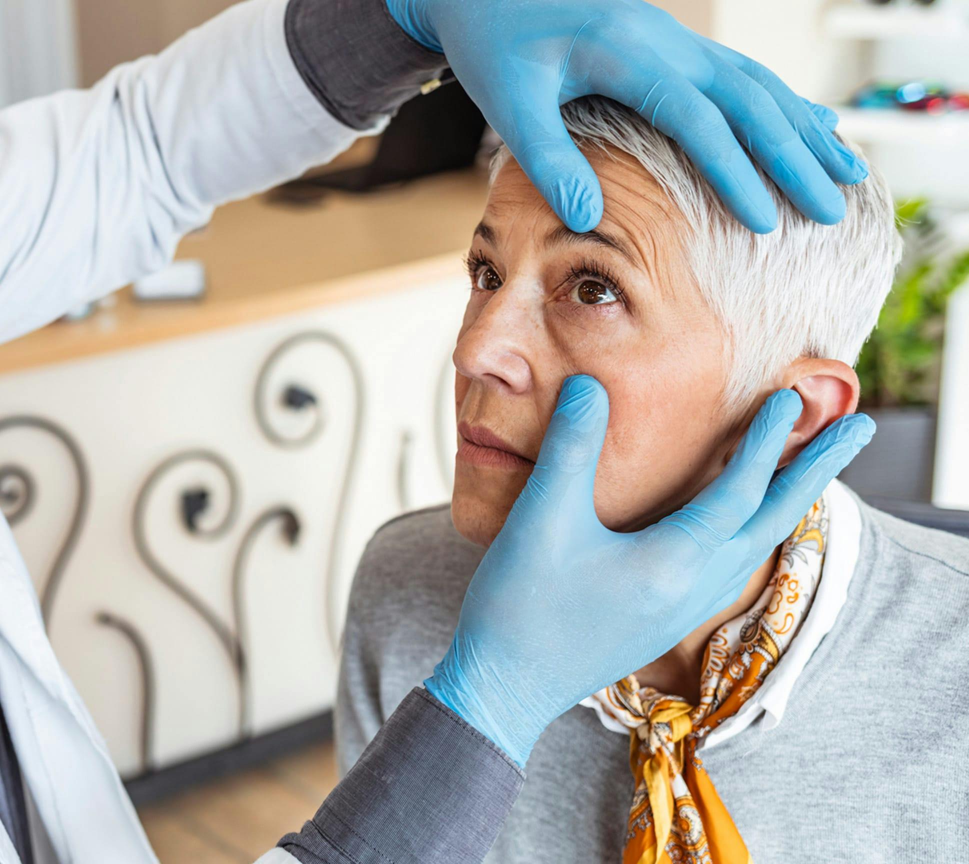 Eye specialist performing eye examination