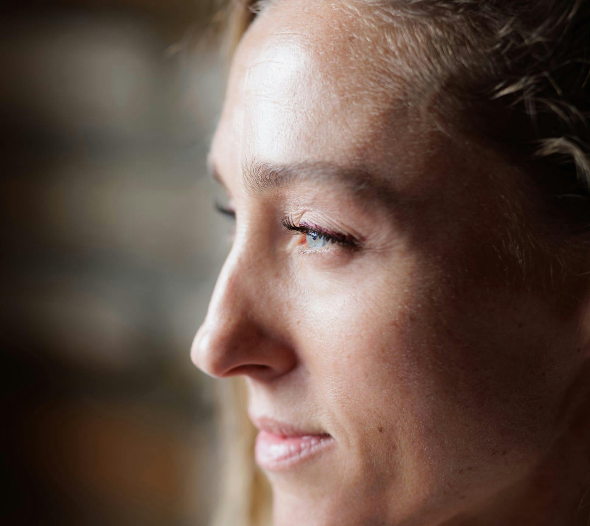 woman looking out a window