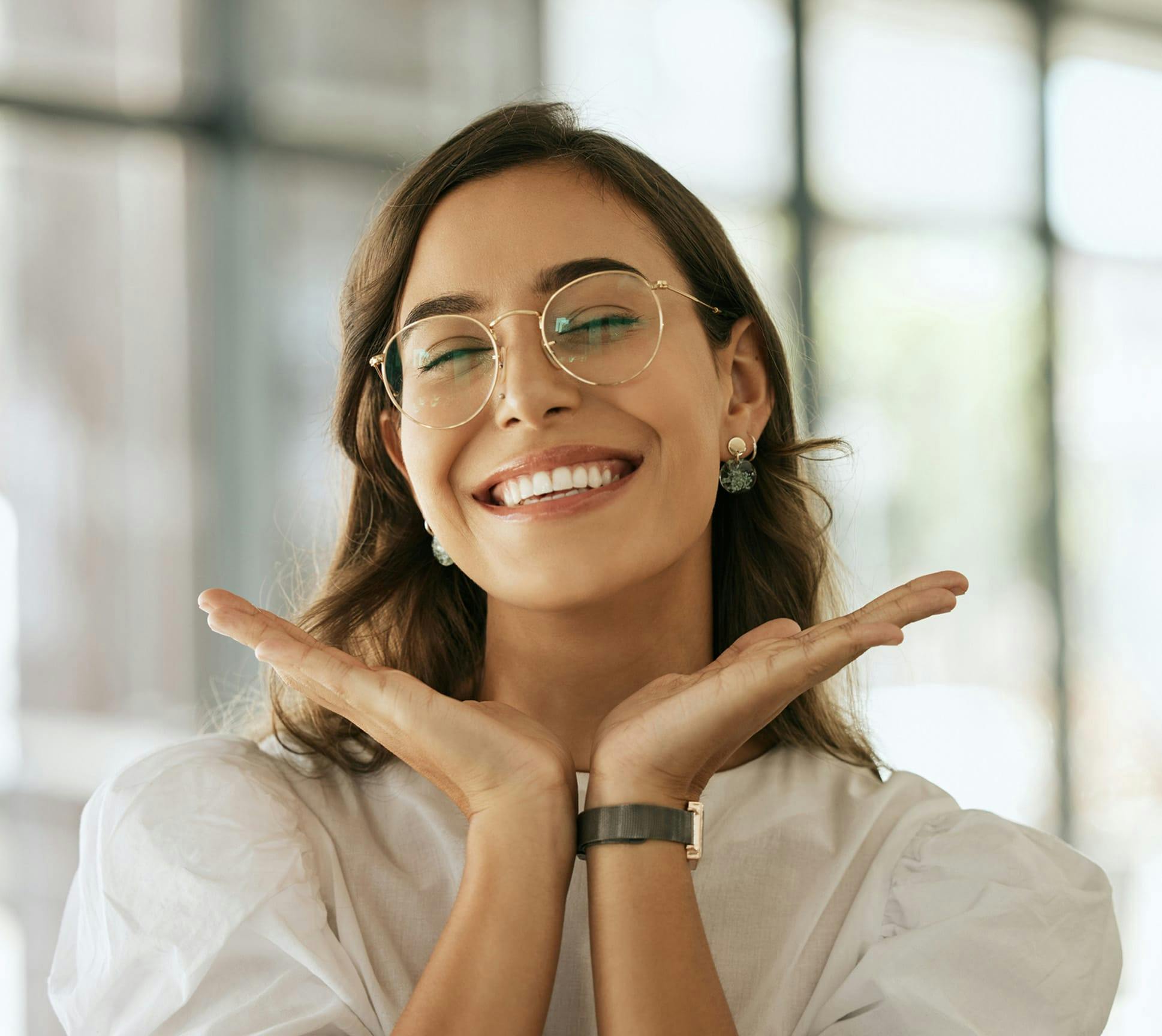 woman wearing glasses and smiling
