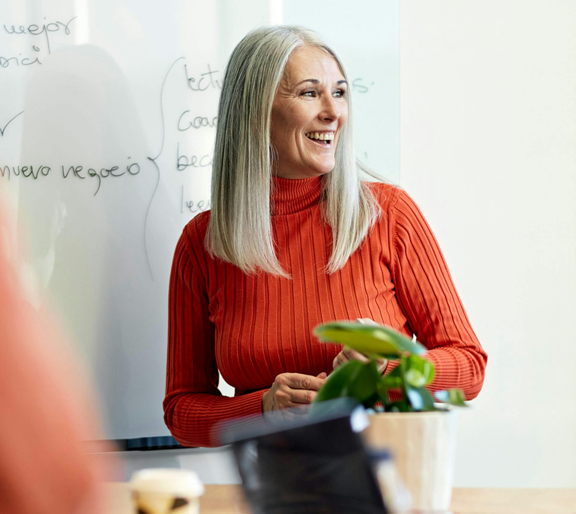 smiling woman in red sweater