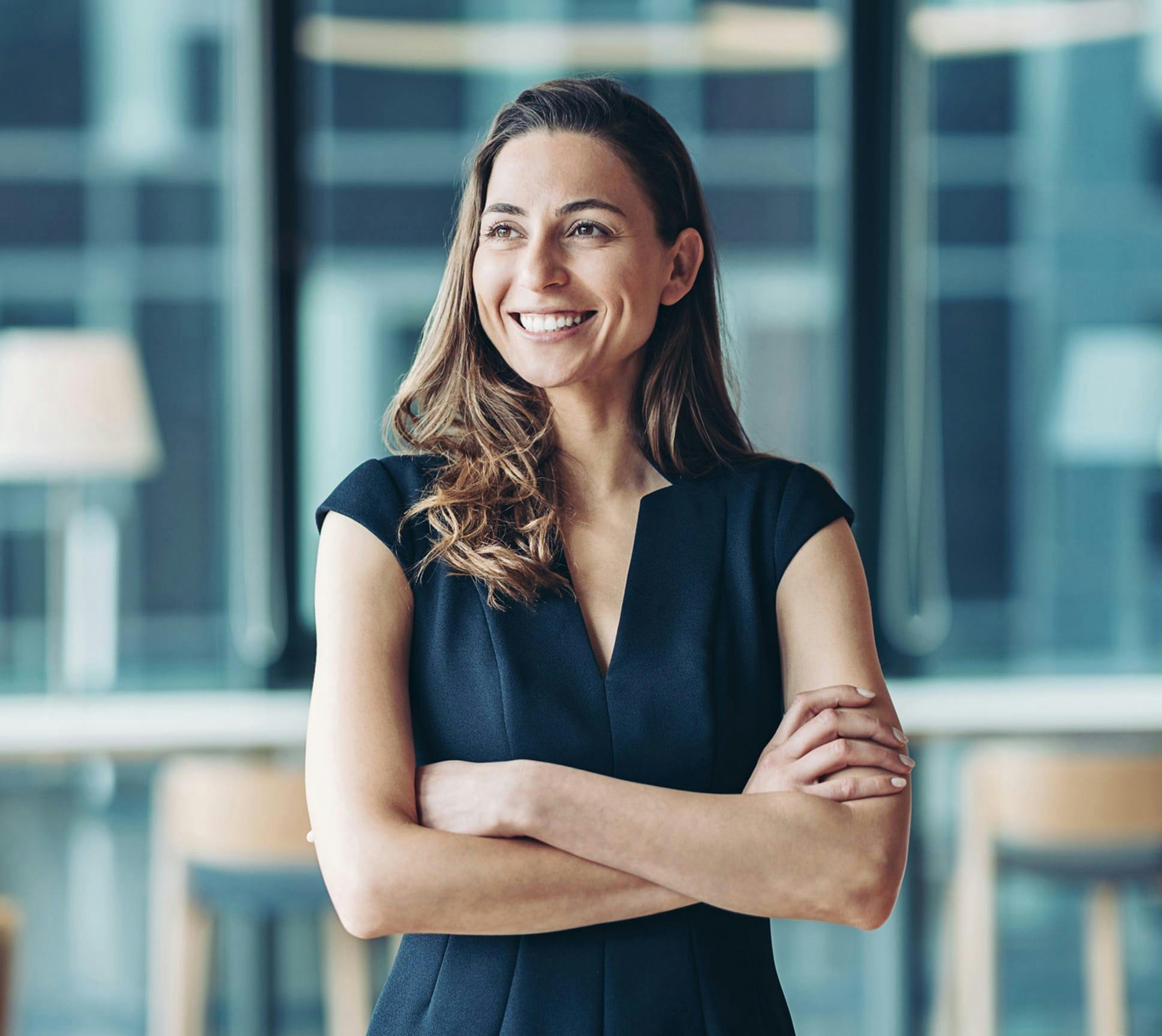 woman smiling with her arms crossed