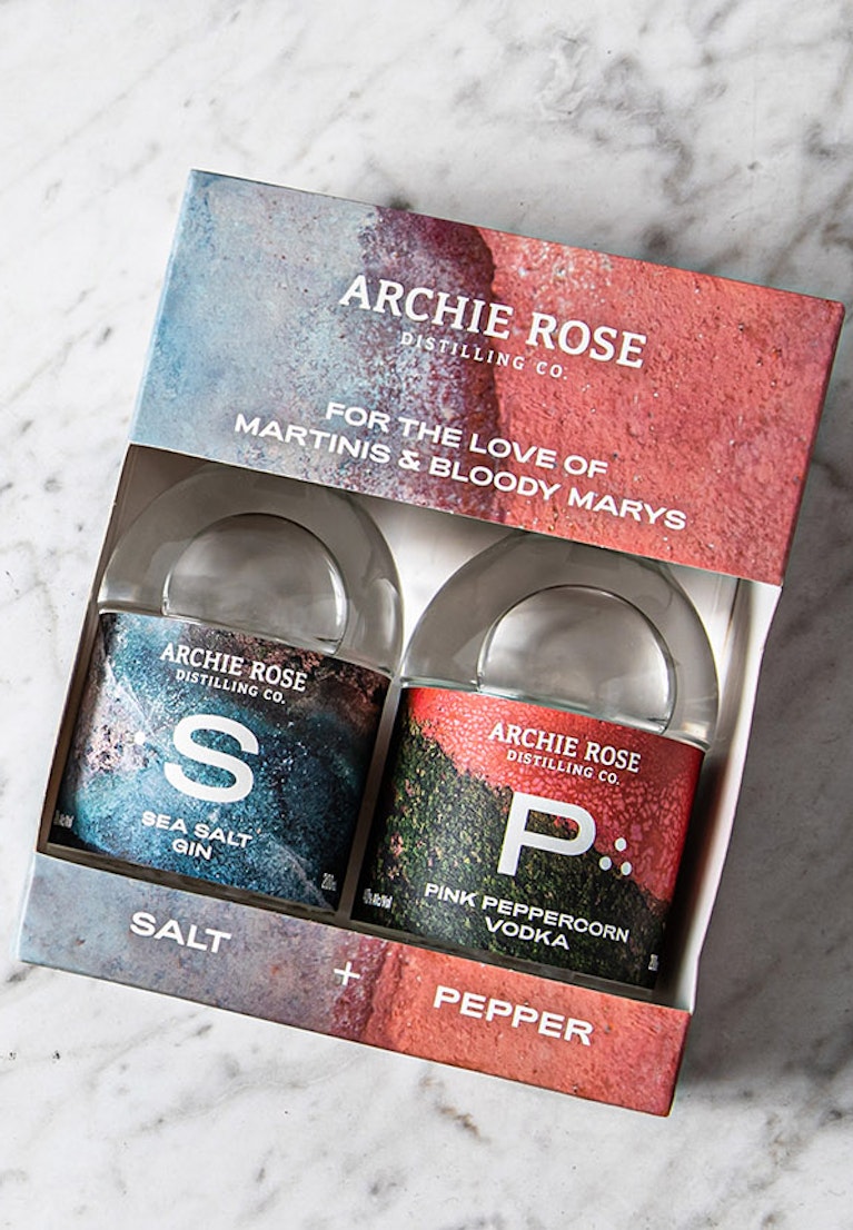 overhead-shot-of-archie-rose-salt-and-pepper-kit-including-two-200-ml-bottles-in-a-pack