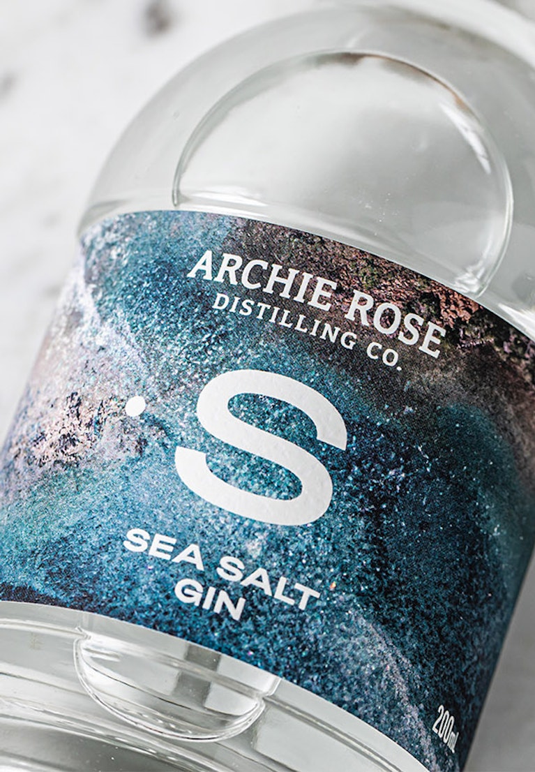overhead-shot-of-archie-rose-sea-salt-gin-front-label