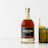 Thumbnail for archie-rose-goode-whiskey-front-on-full-bottle-shot-on-table-beside-whisky-cocktail-and-fresh-limes