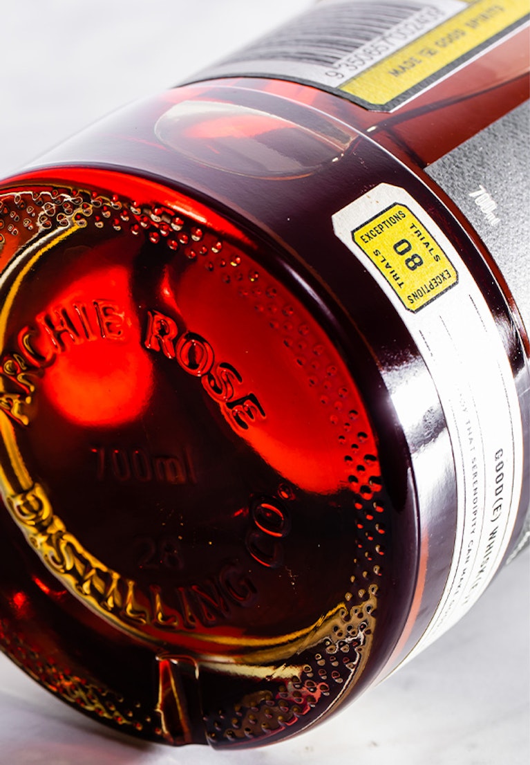 overhead-shot-of-archie-rose-goode-whisky-bottom-of-bottle